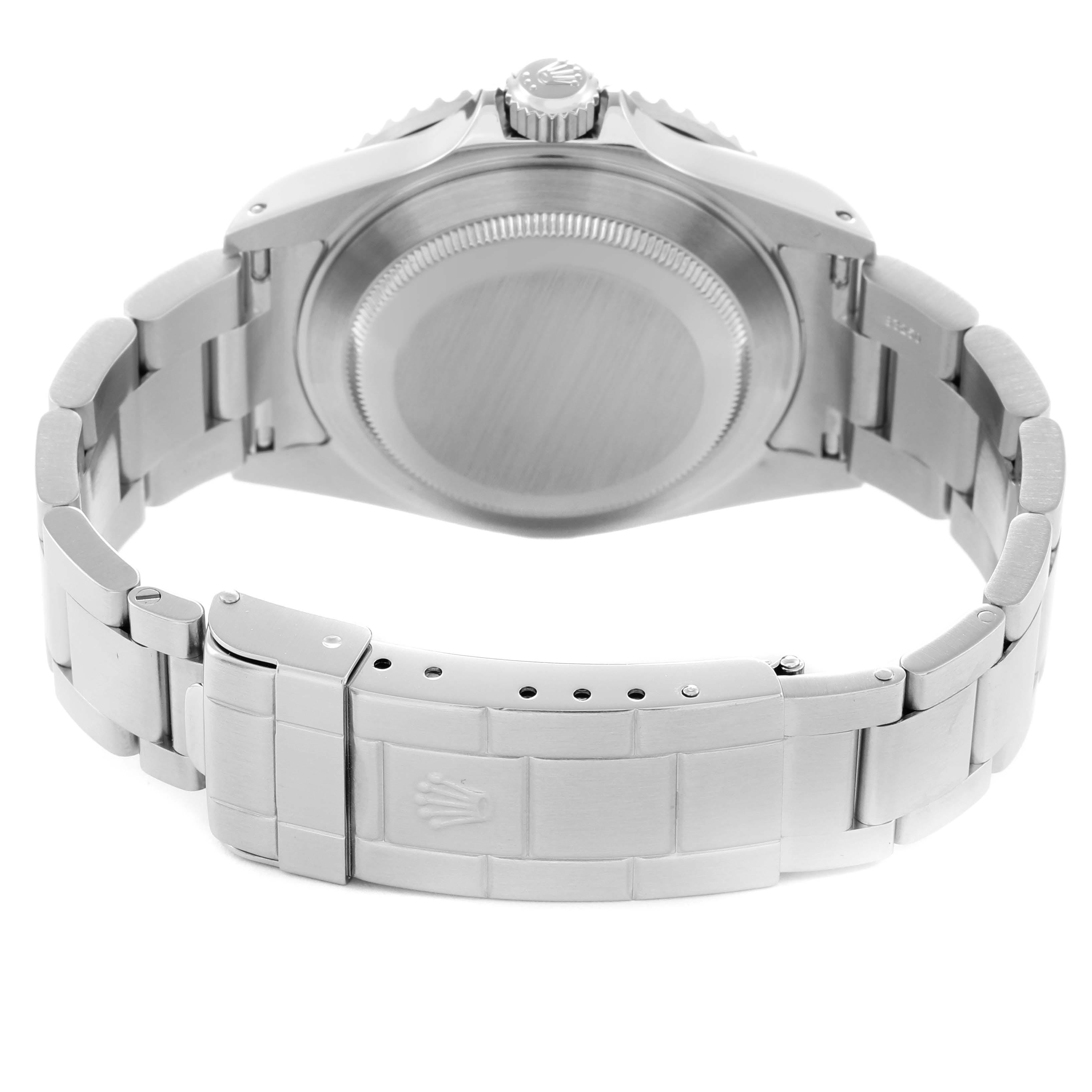 The image shows a rear view of the Rolex Submariner 16610 Men
s Stainless Steel Black Dial 16610 Men
s Stainless Steel Black Dial, focusing on the case back, bracelet, and clasp.