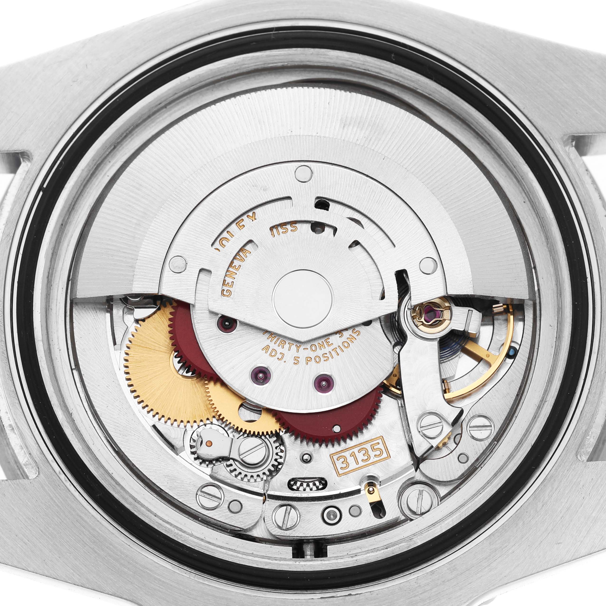 The image shows the movement of a Rolex Submariner 116610 Mens Stainless Steel Black Dial, highlighting gears and other internal components from the back.