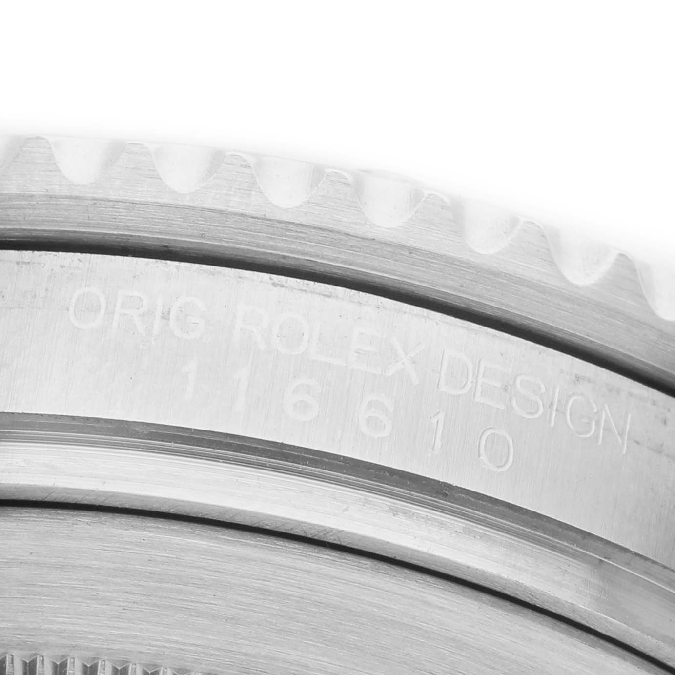 The image shows a close-up of the bezel and edge with engraved text of a Rolex Submariner 116610 Mens Stainless Steel Black Dial.