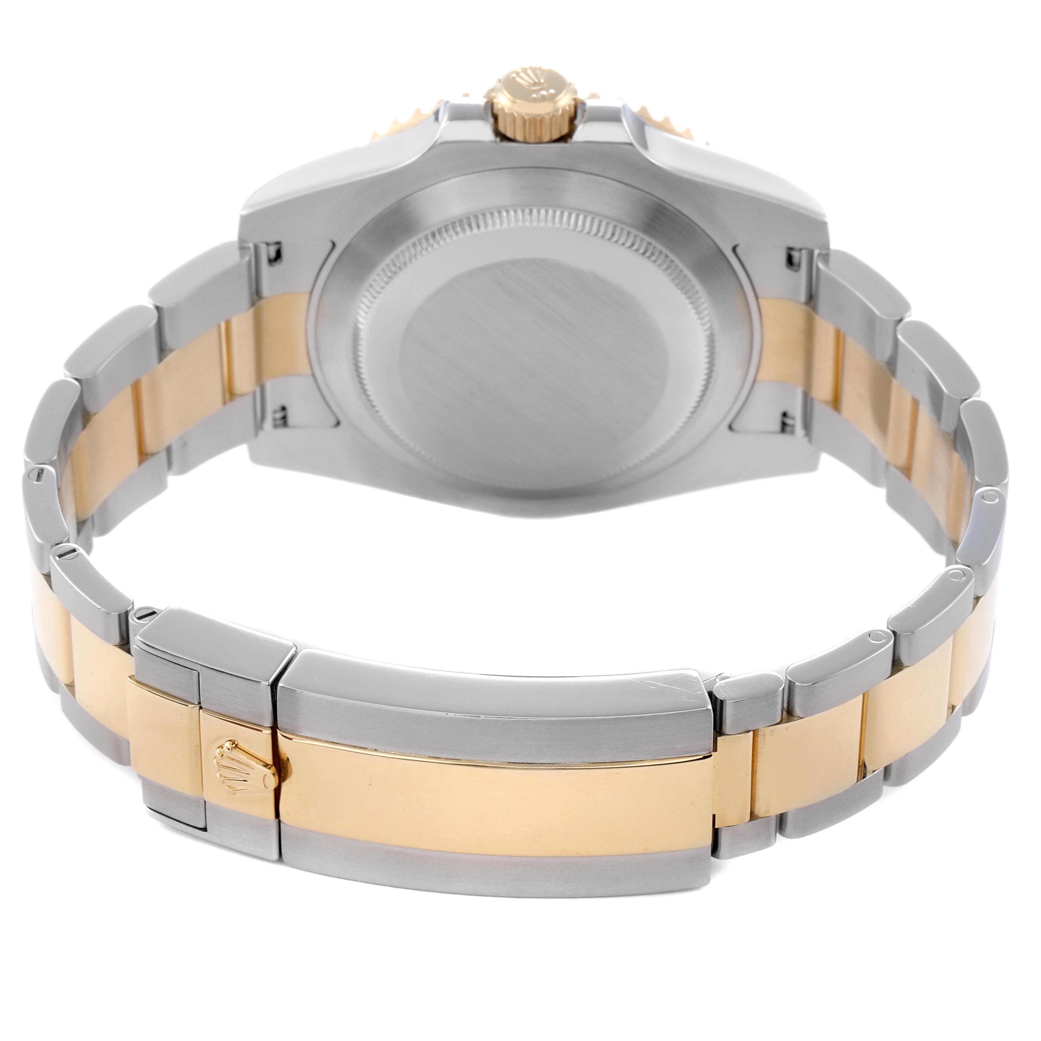 The image shows the back and bracelet of a Rolex Submariner 116613 Men
s Steel and Gold (two tone) Black Dial 116613 Men
s Steel and Gold (two tone) Black Dial watch, highlighting the two-tone metal design and clasp.