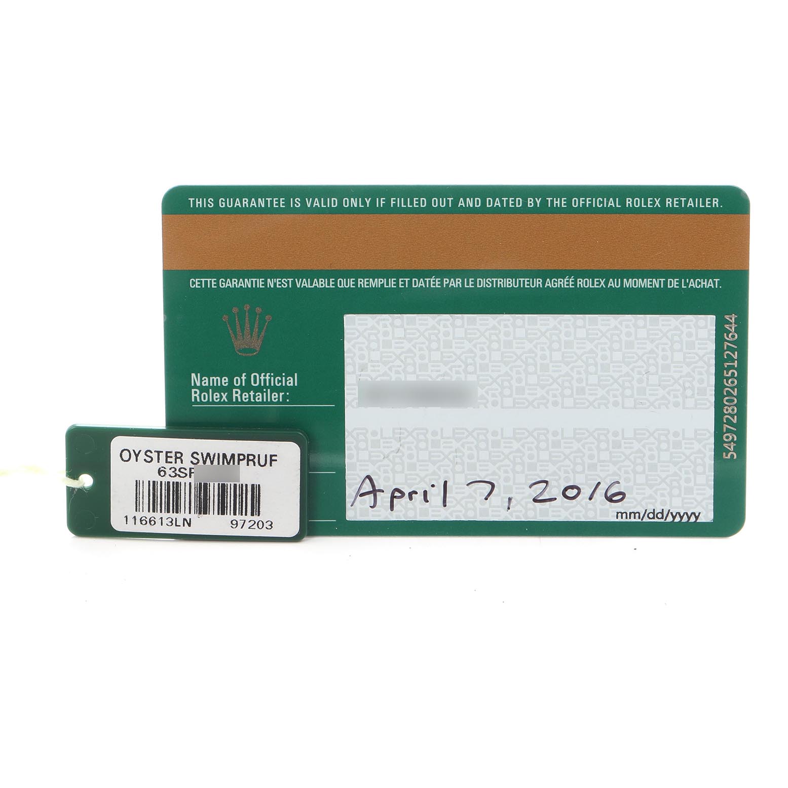 The image shows a guarantee card and a tag for a Rolex Submariner 116613 Men
s Steel and Gold (two tone) Black Dial 116613 Men
s Steel and Gold (two tone) Black Dial, indicating the model and purchase date.