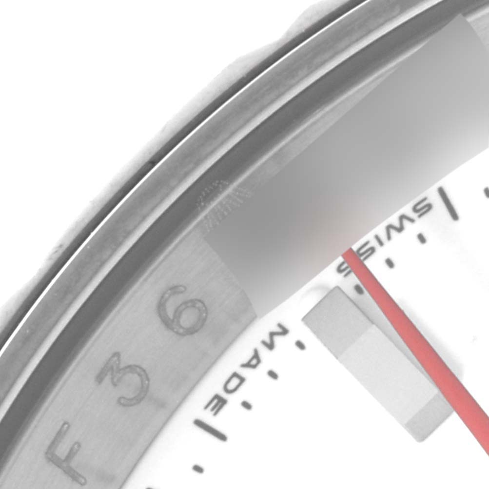Close-up of the Rolex Turn-o-Graph 116264 Men's Stainless Steel White Dial 116264 Men's Stainless Steel White Dial watch showing the bezel, part of the dial, and red seconds hand.