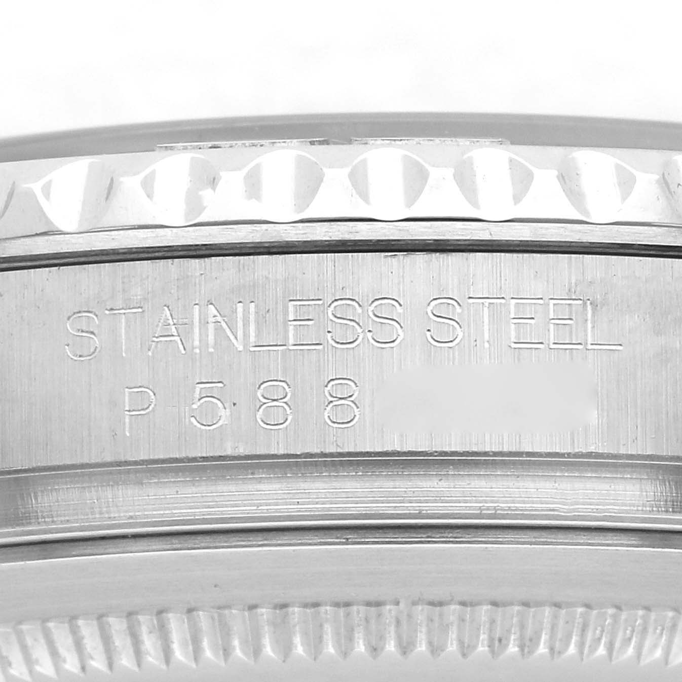 The image shows a close-up of the side of a Rolex Yacht-Master 16622 Men
s Stainless Steel Silver Dial 16622 Men
s Stainless Steel Silver Dial watch case, highlighting the stainless steel and serial number engraving.