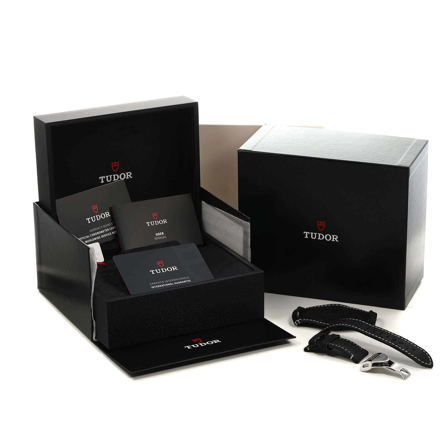 The image shows the Tudor Heritage Black Bay 79360 Men's Stainless Steel Silver Dial packaging, including the box, manuals, and straps, viewed from a front-left angle.