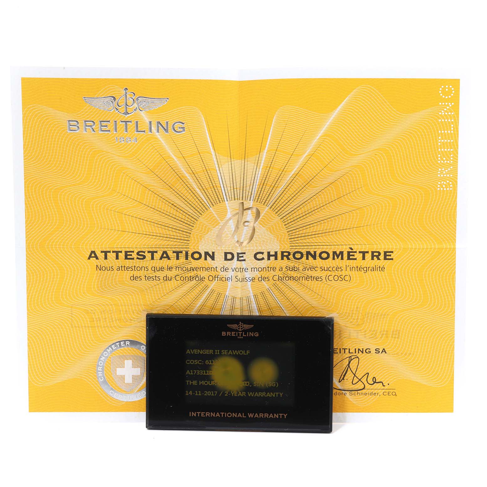 The image shows a Breitling Avenger A17331 Men's Stainless Steel Black Dial A17331 Men's Stainless Steel Black Dial watch with a yellow "Attestation de Chronomètre" certificate and an international warranty card.