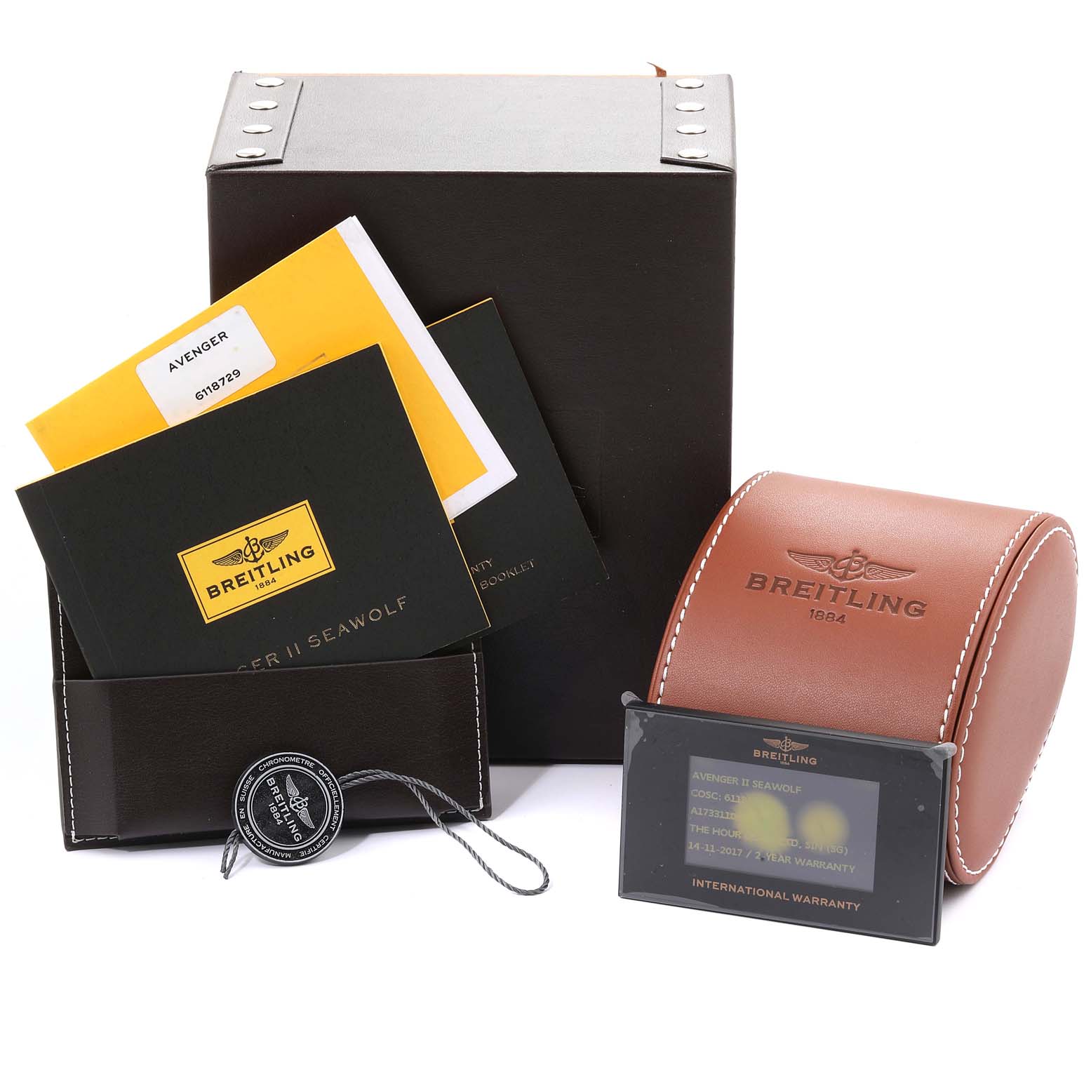 This image shows the packaging, warranty card, and manuals for a Breitling Avenger A17331 Men's Stainless Steel Black Dial A17331 Men's Stainless Steel Black Dial watch.