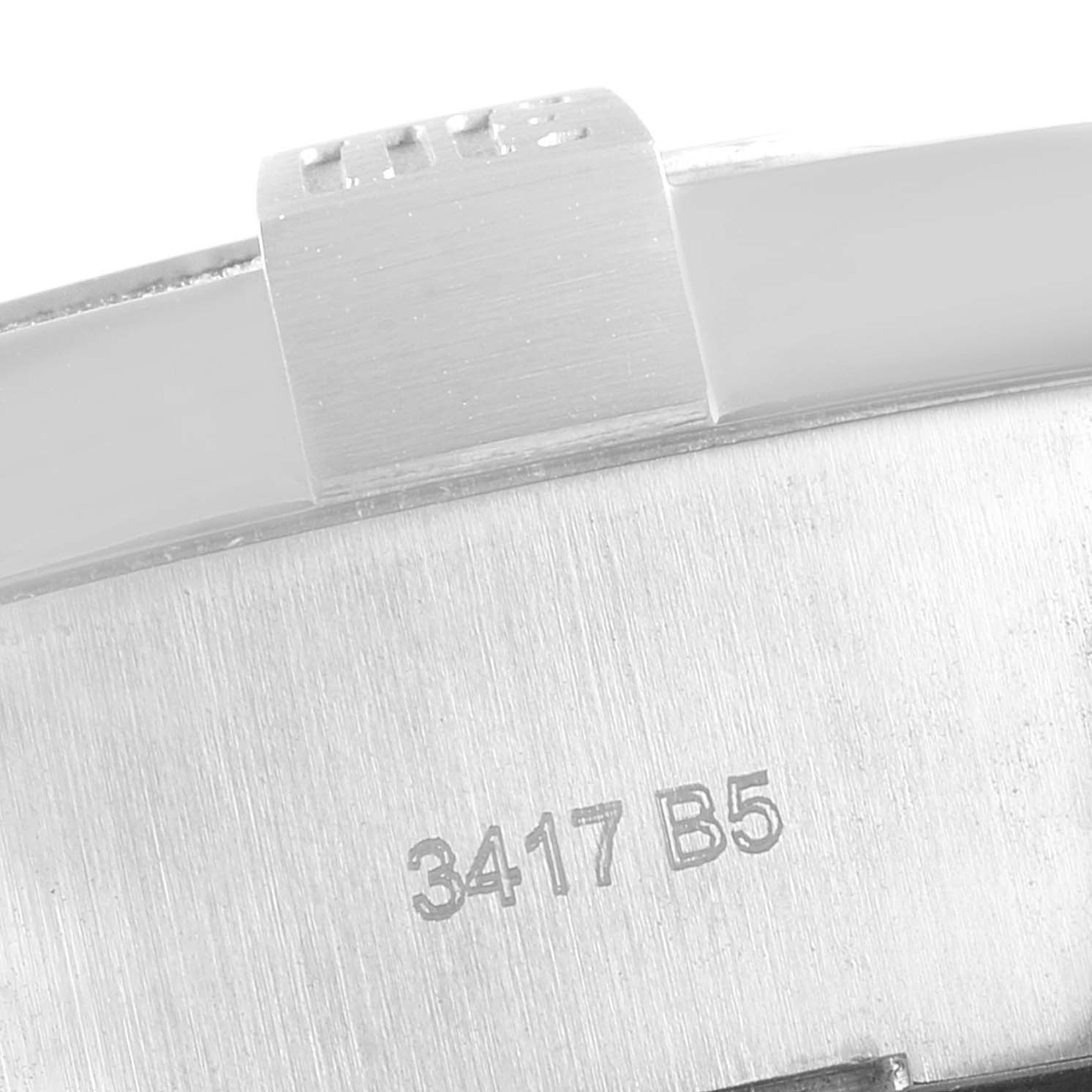 This image displays a close-up of the clasp and a serial number on the backside of a Breitling Avenger A17331 Men's Stainless Steel Black Dial A17331 Men's Stainless Steel Black Dial watch.