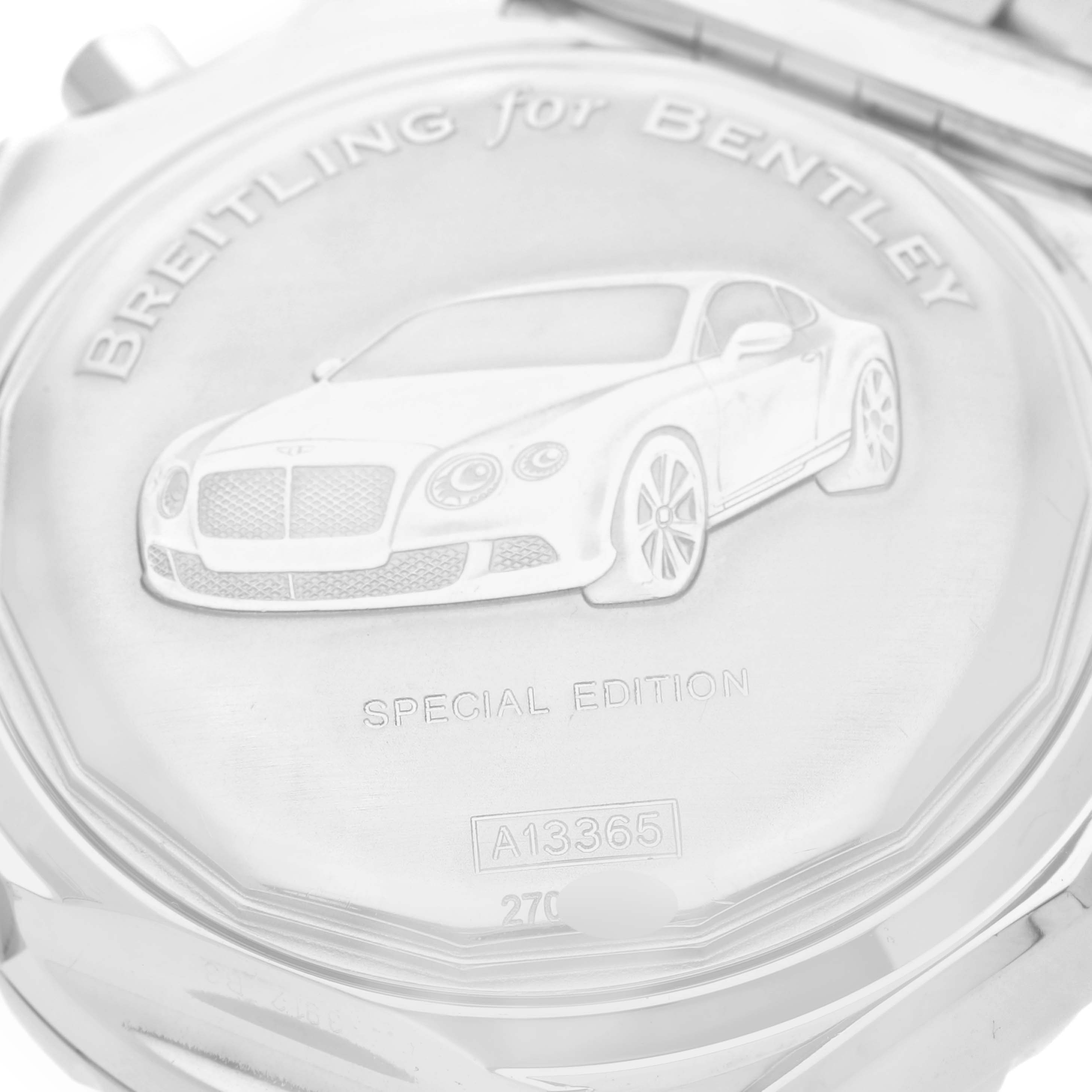 The image shows the case back of a Breitling Bentley A13362 Men's Stainless Steel Red Dial A13362 Men's Stainless Steel Red Dial model watch, featuring an engraved car and text.