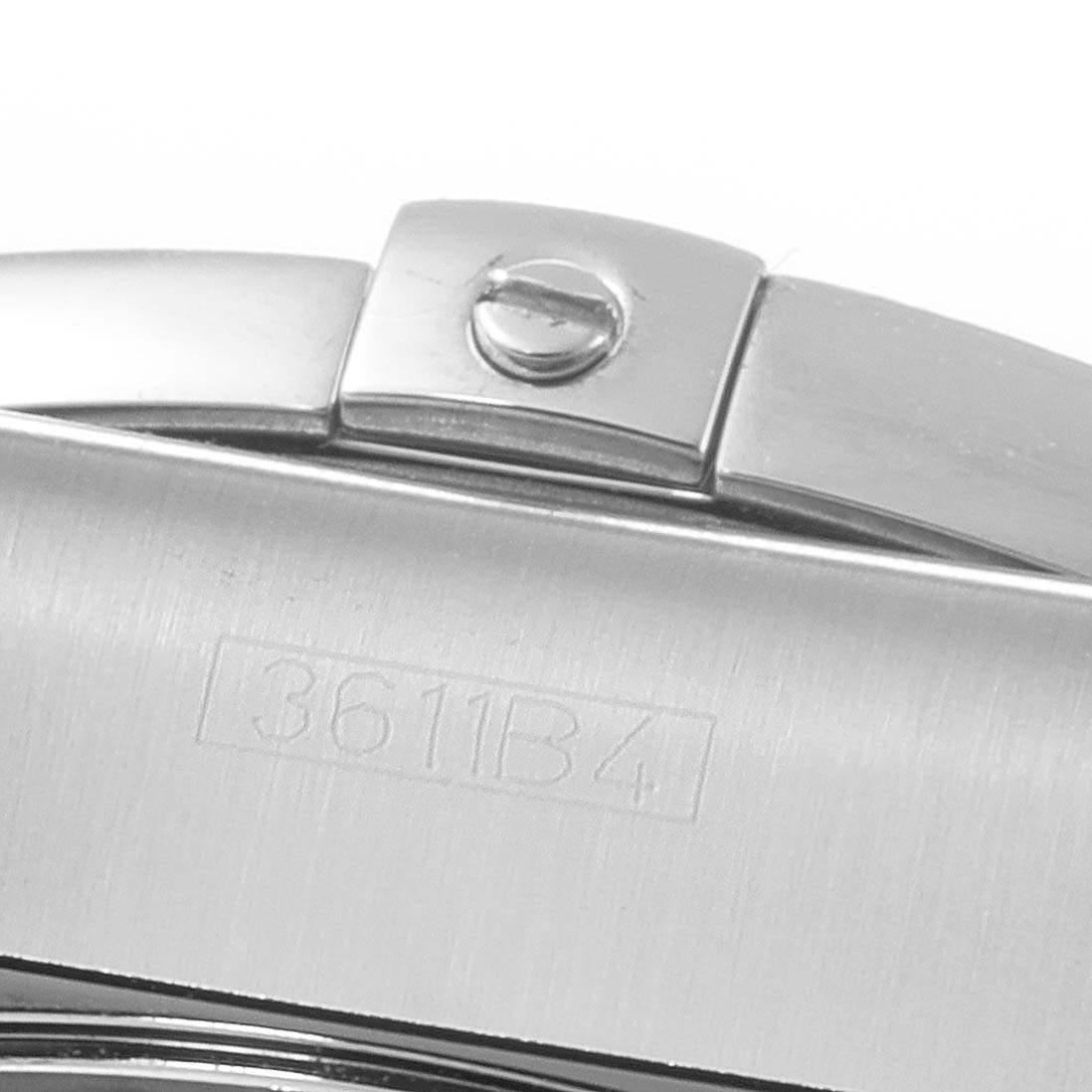 This image shows a close-up angle of a clasp from a Breitling Chronomat AB0110 Men
s Stainless Steel Black Dial AB0110 Men
s Stainless Steel Black Dial watch, featuring a screw and serial number 3611B4.