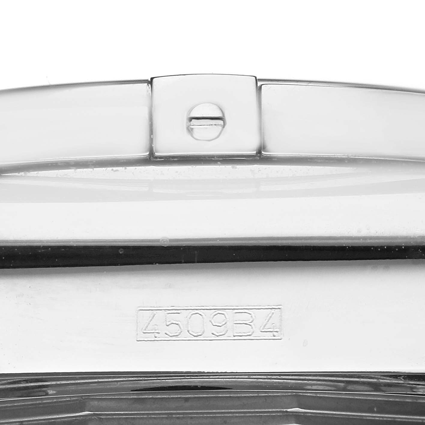 The image shows a close-up of the clasp and part of the strap for a Breitling Chronomat AB011012/Q575 Men
s Stainless Steel Brown Dial AB011012/Q575 Men
s Stainless Steel Brown Dial watch, with a visible serial number.