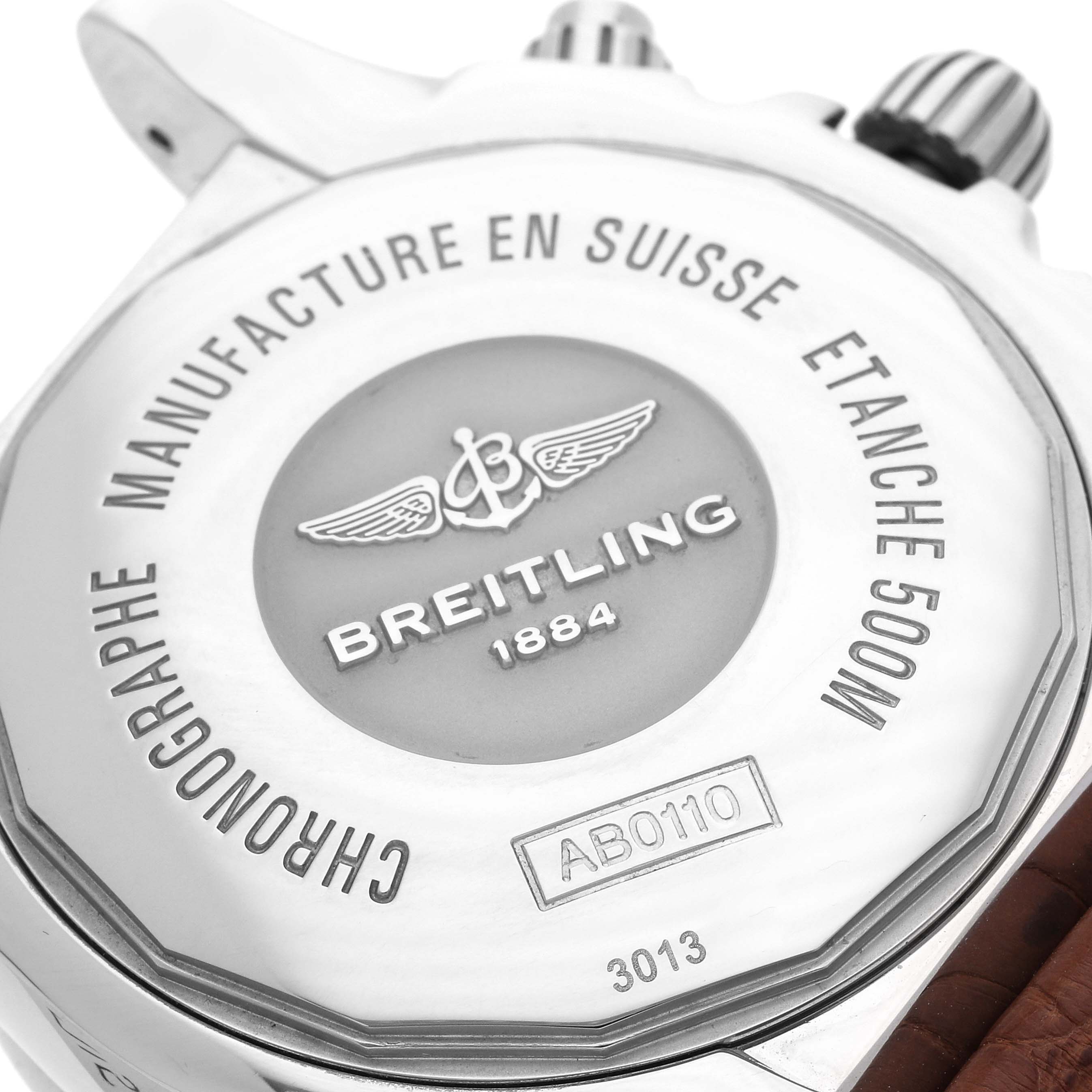 The image shows the back of a Breitling Chronomat AB011012/Q575 Men
s Stainless Steel Brown Dial AB011012/Q575 Men
s Stainless Steel Brown Dial watch, focusing on the engraved case and crown.