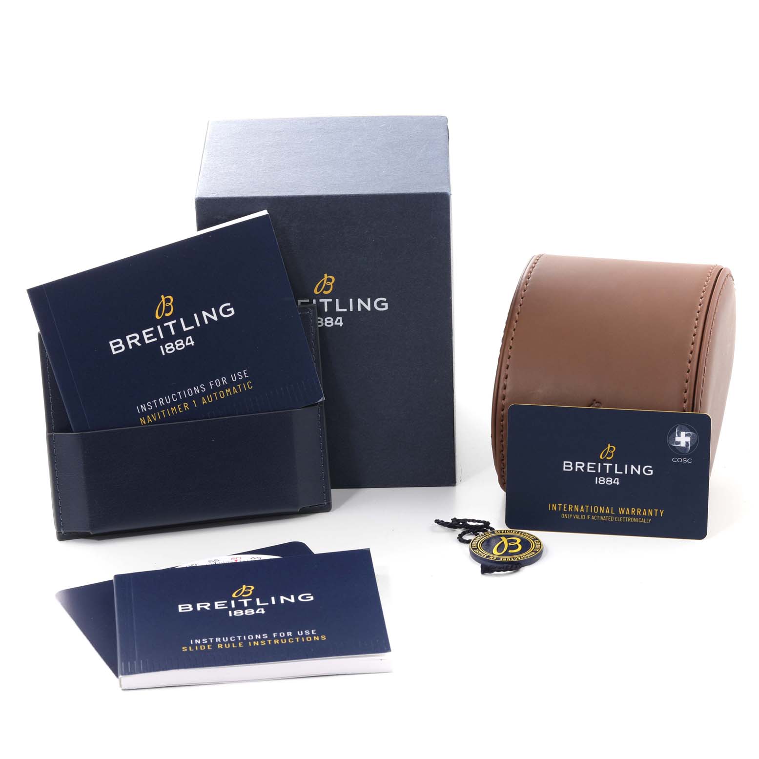The image shows the packaging, manuals, warranty card, and leather travel case for a Breitling Navitimer A17325 Men
s Stainless Steel Blue Dial A17325 Men
s Stainless Steel Blue Dial watch.