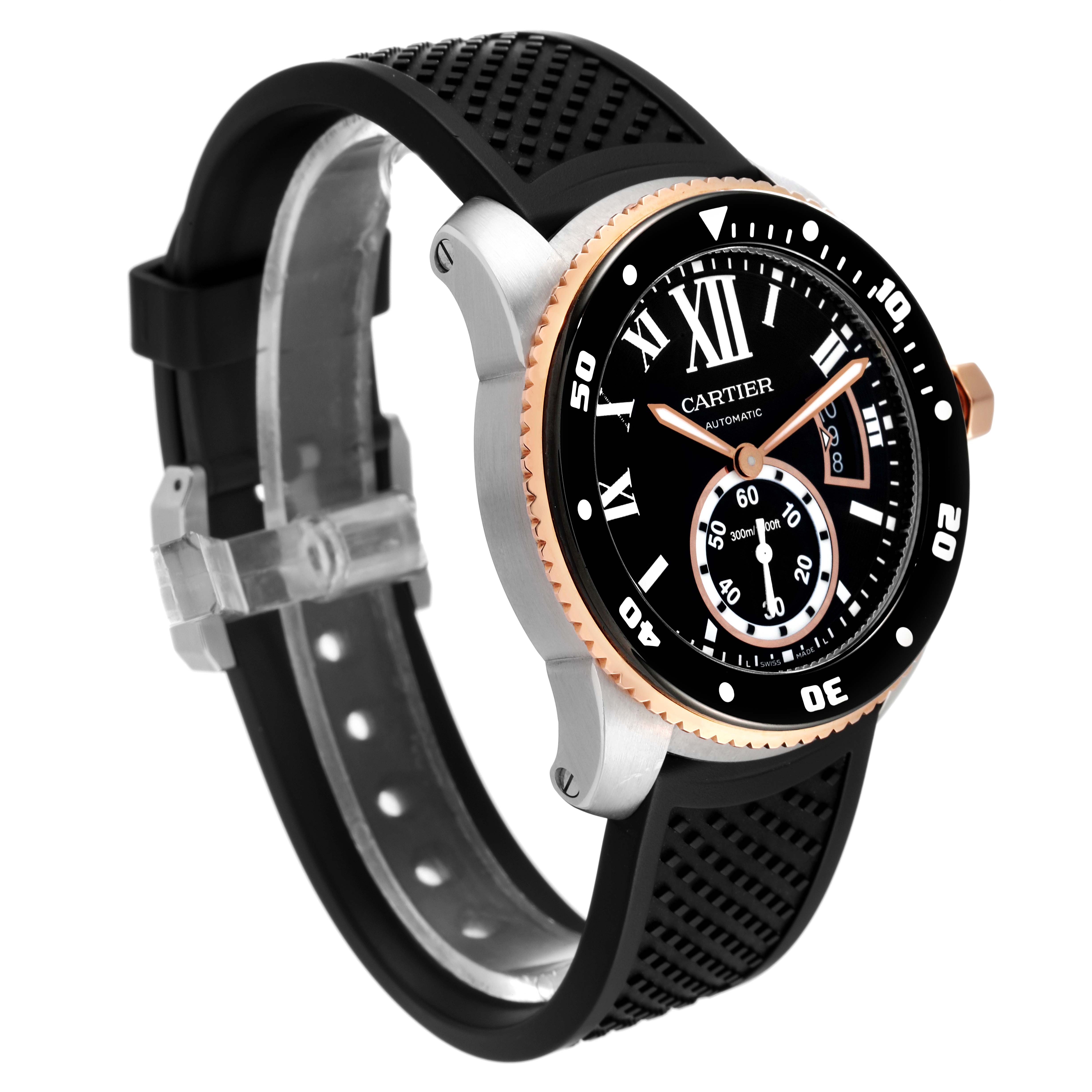 The image shows a Calibre de Cartier watch by Cartier from an angle highlighting the bezel, dial, and black rubber strap.