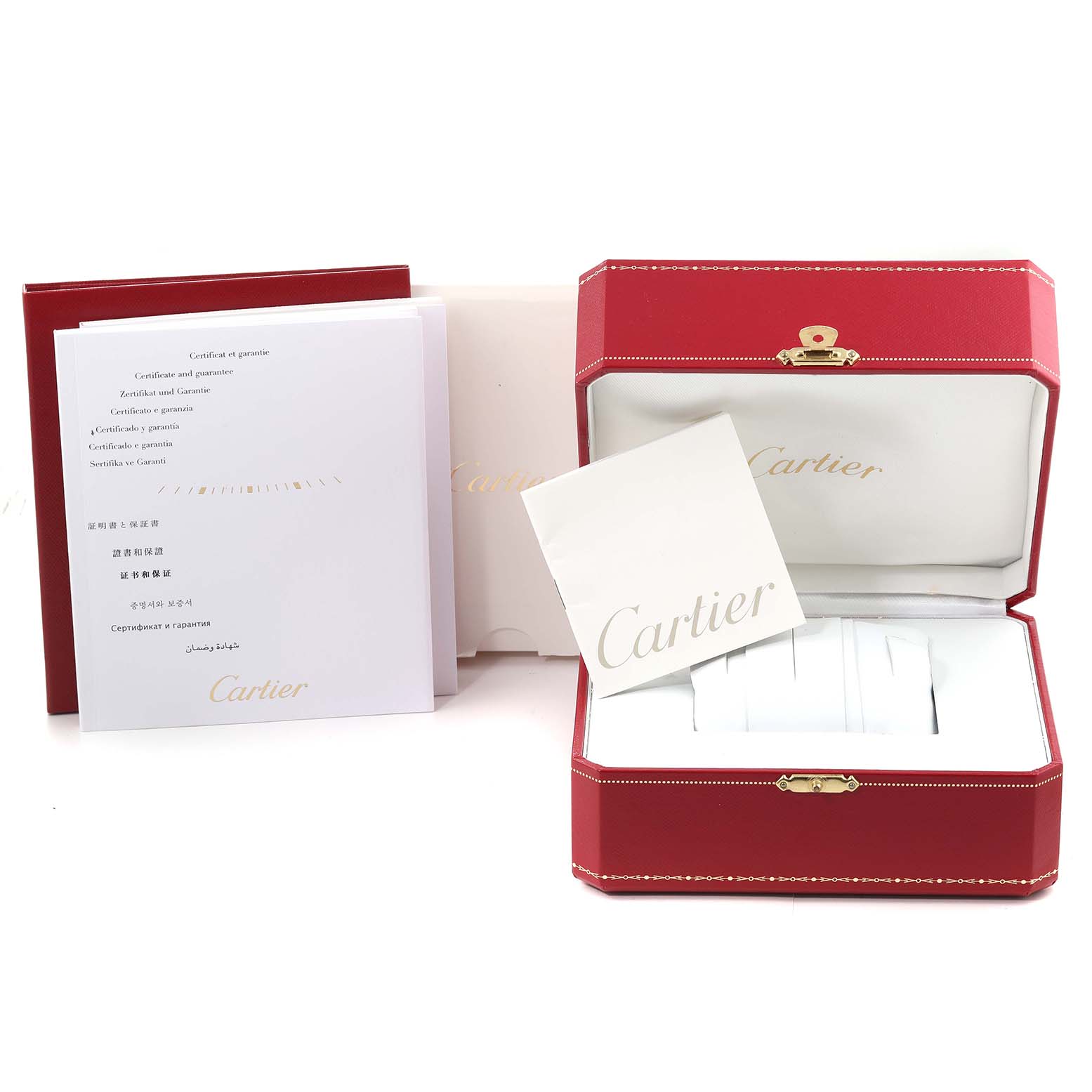 This image shows the packaging and documentation for the Calibre de Cartier model by Cartier, including the box and booklets.