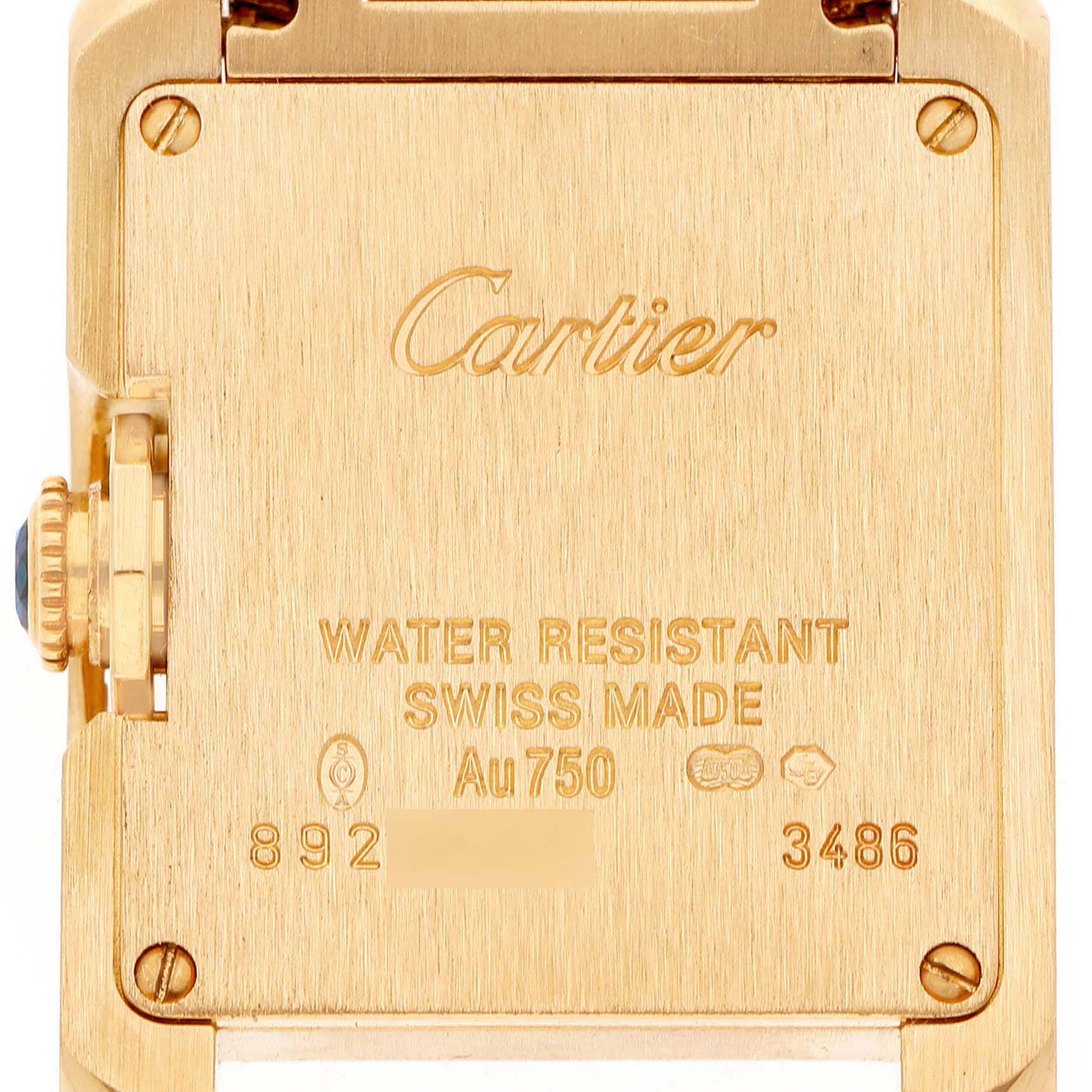 The image shows the backplate of a Cartier Tank Anglaise W5310014 Women's Yellow Gold Silver Dial watch, including branding and specifications.