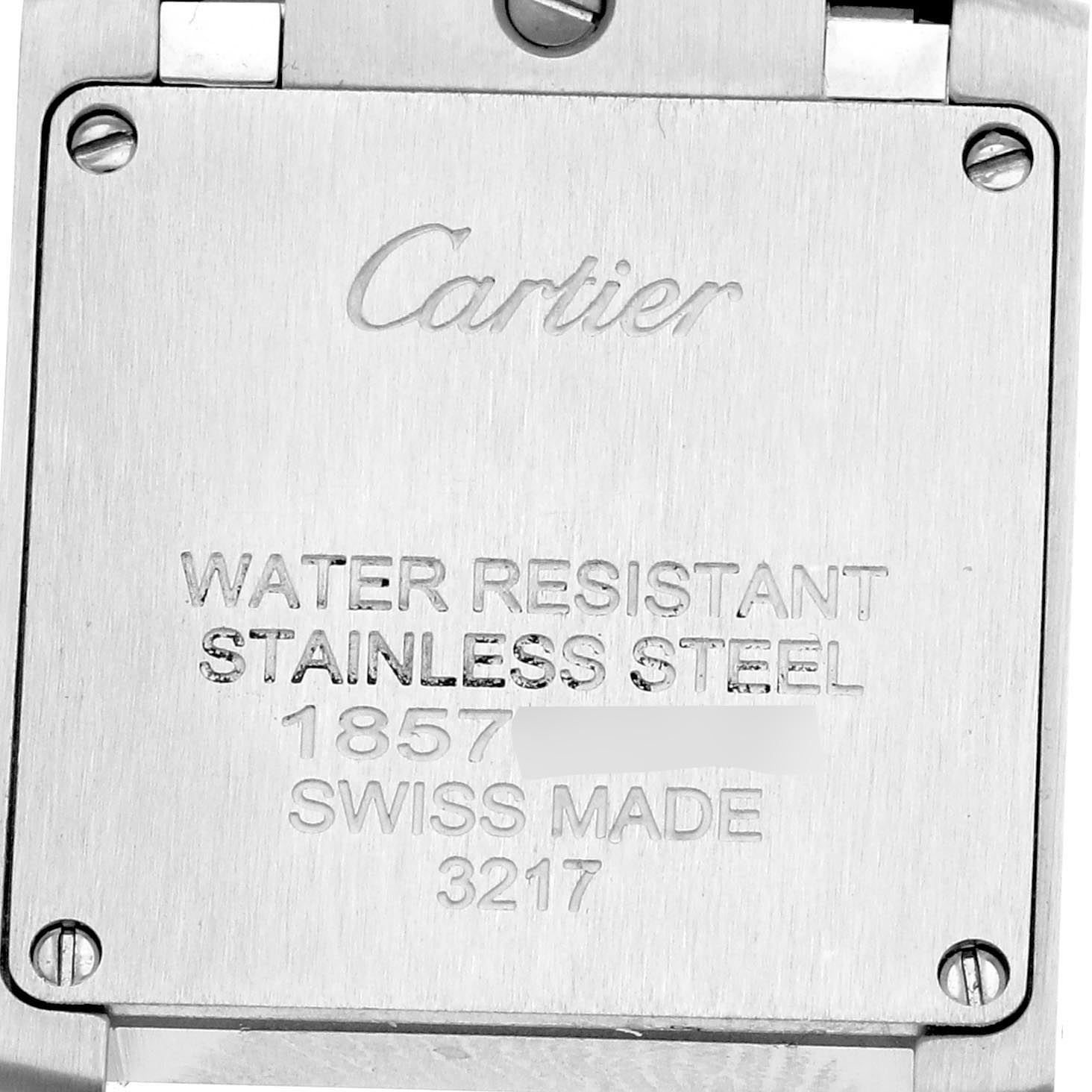 The image shows the back case of a Cartier Tank Francaise W51008Q3 Women
s Stainless Steel Silver Dial W51008Q3 Women
s Stainless Steel Silver Dial watch, displaying engraved details about its materials and specifications.