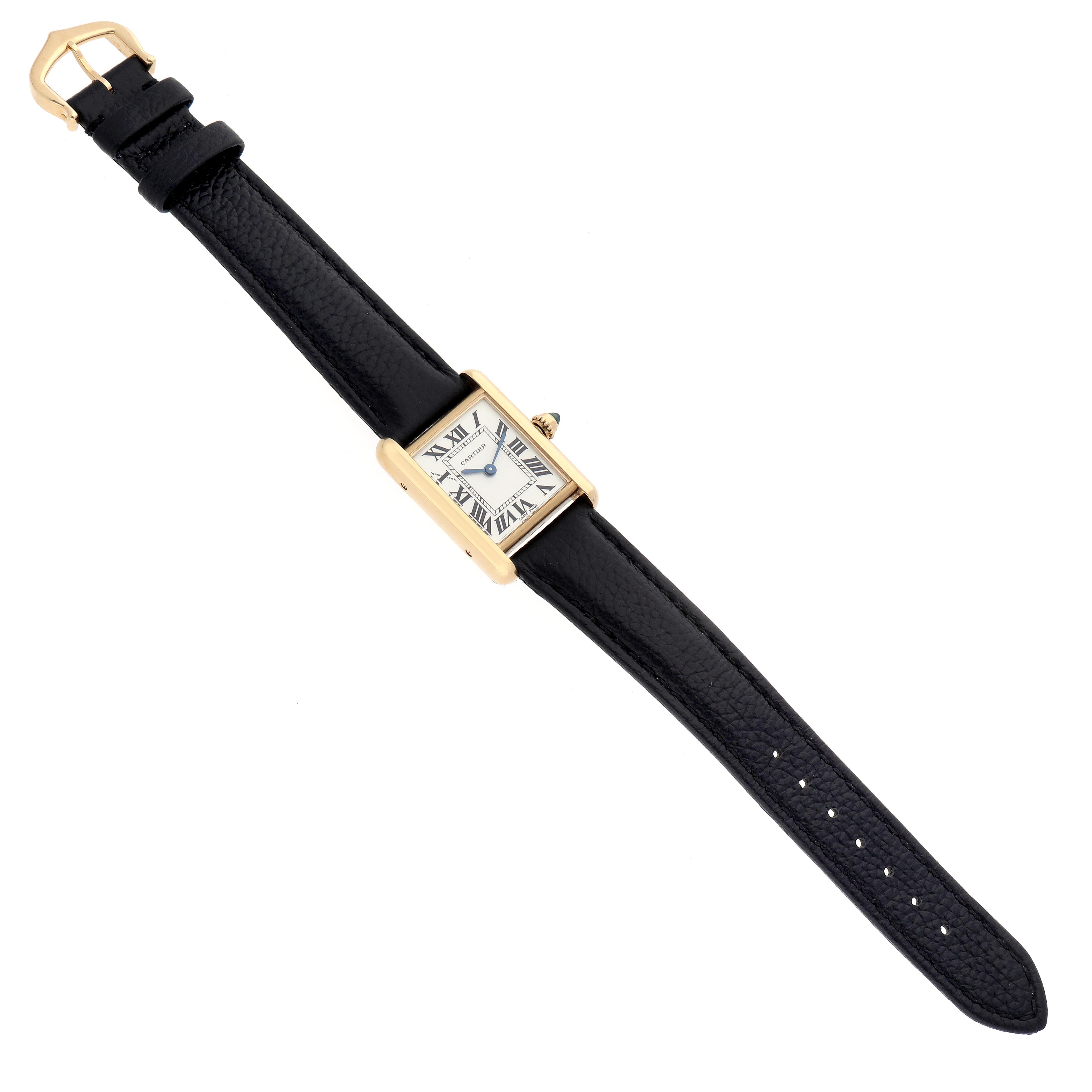 The Cartier Tank Louis W1529856 Women
s Yellow Gold White Dial W1529856 Women
s Yellow Gold White Dial watch is shown from a top-down angle, displaying the face, case, and full leather strap.