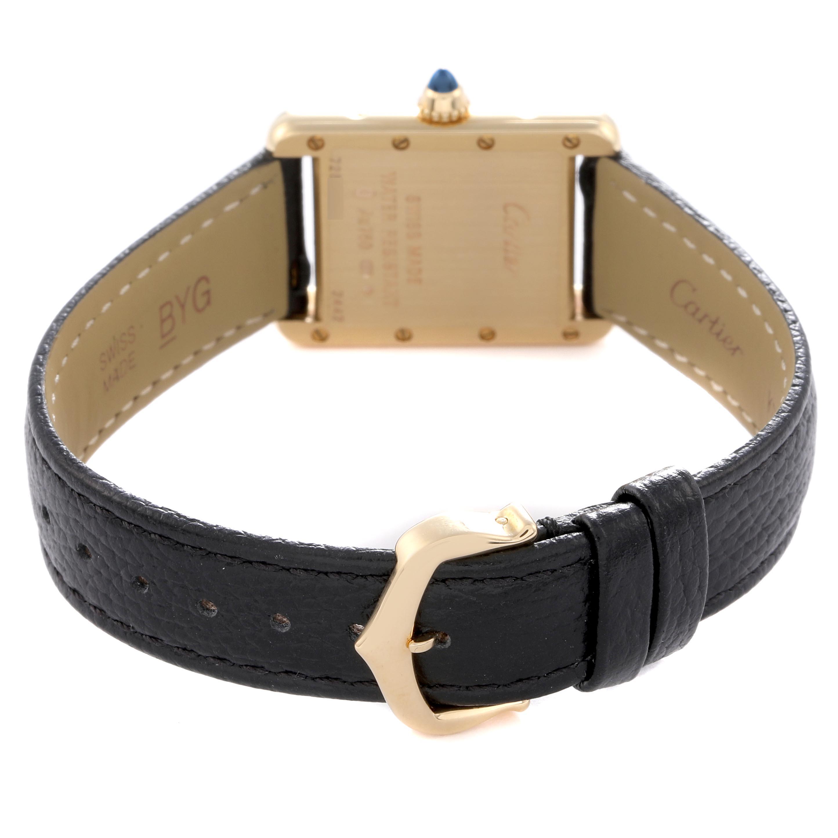 The image shows the back of a Cartier Tank Louis W1529856 Women
s Yellow Gold White Dial W1529856 Women
s Yellow Gold White Dial watch, focusing on the buckle, strap, and case back.