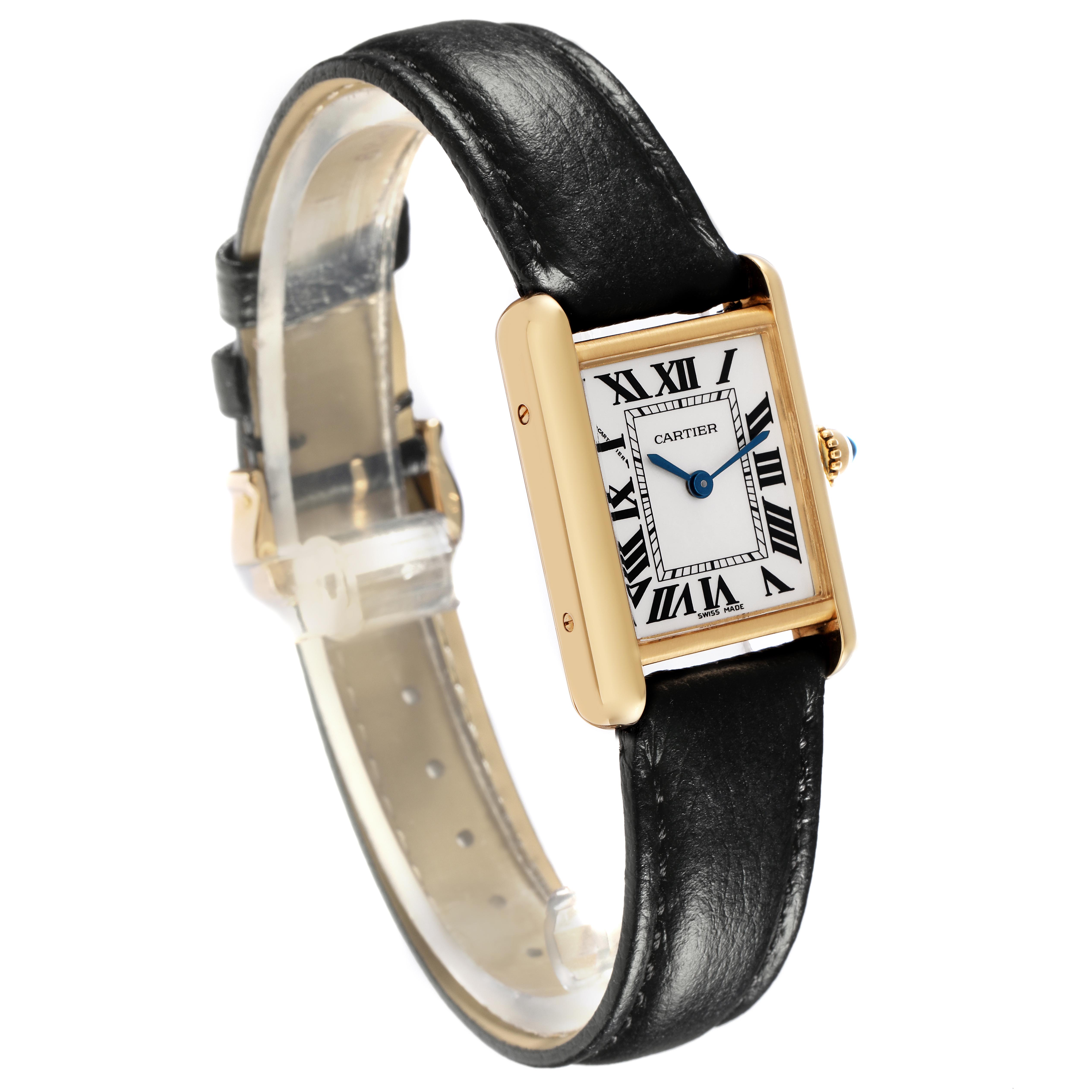The Cartier Tank Louis W1529856 Women
s Yellow Gold White Dial W1529856 Women
s Yellow Gold White Dial watch is shown from a front-angled view, displaying the dial, case, and leather strap clearly.
