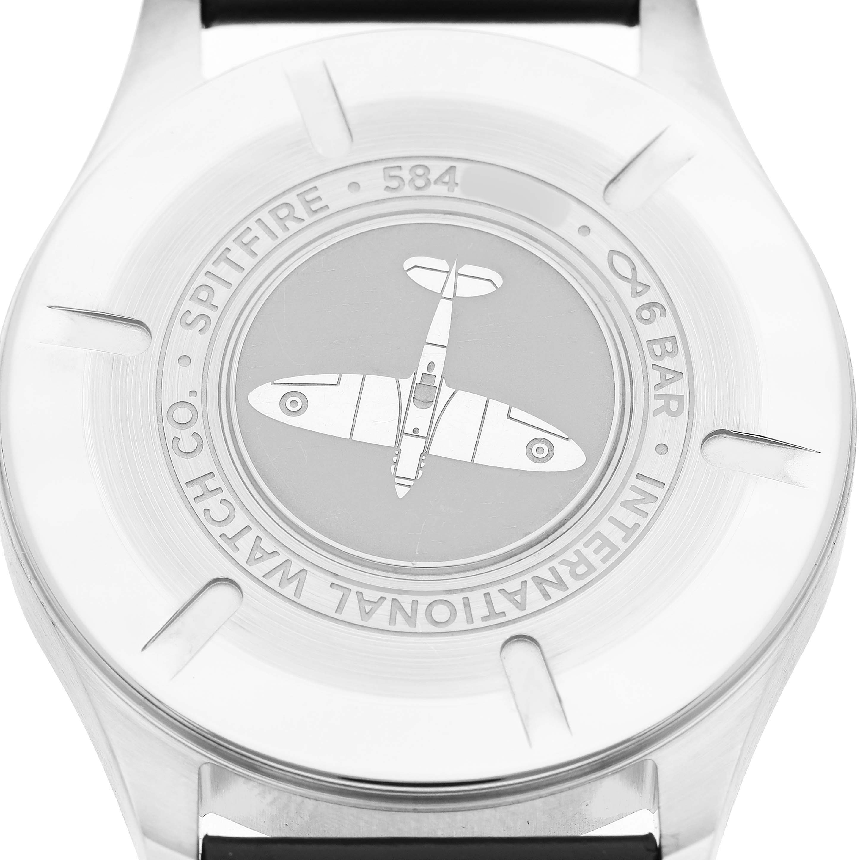 The image shows the back case of an IWC Pilot IW326801 Men's Stainless Steel Black Dial watch, featuring a Spitfire engraving and model details.