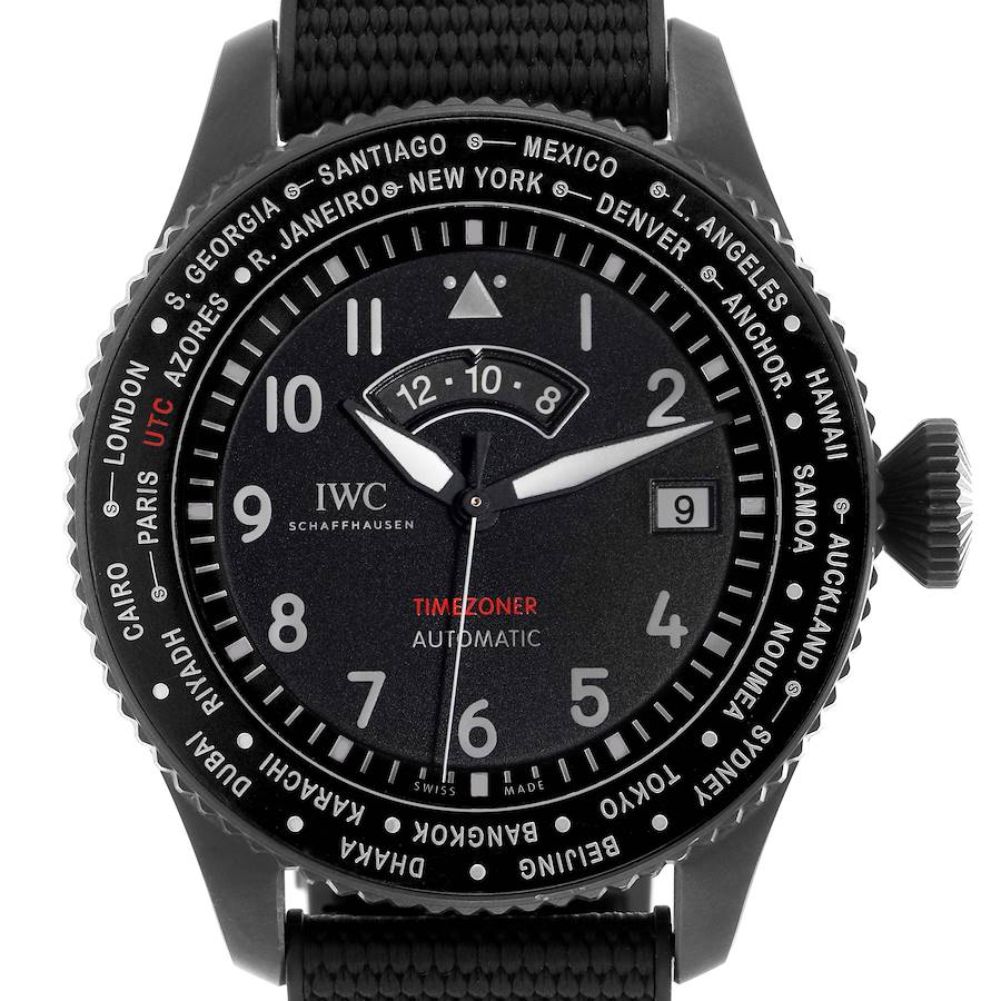 The IWC Pilot's watch is shown from a front angle, highlighting the bezel, dial, hands, crown, and cities for time zone reference.