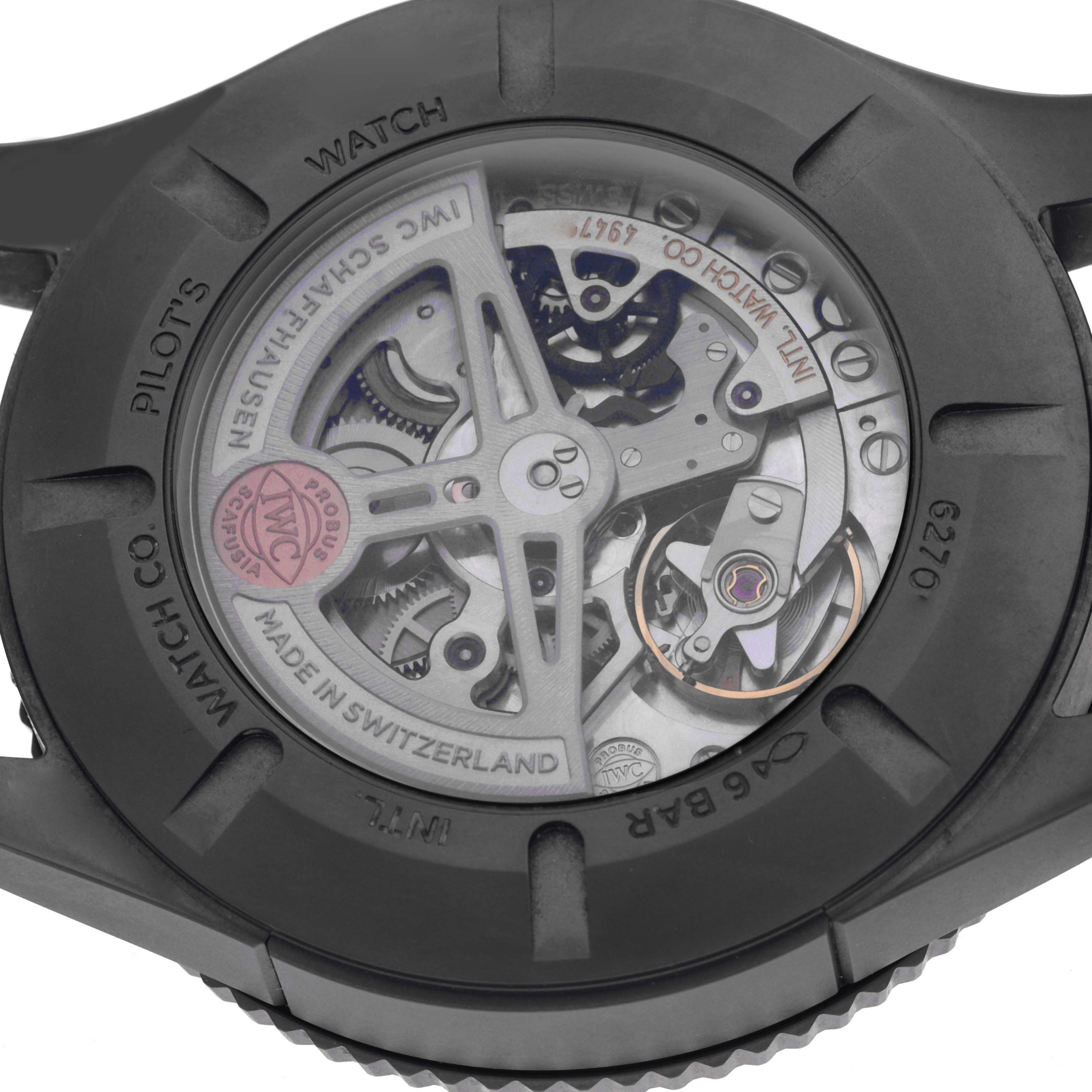 The image shows the back of an IWC Pilot IW395505 Men
s Ceramic Black Dial IW395505 Men
s Ceramic Black Dial model watch, revealing its intricate movement through a transparent case back.