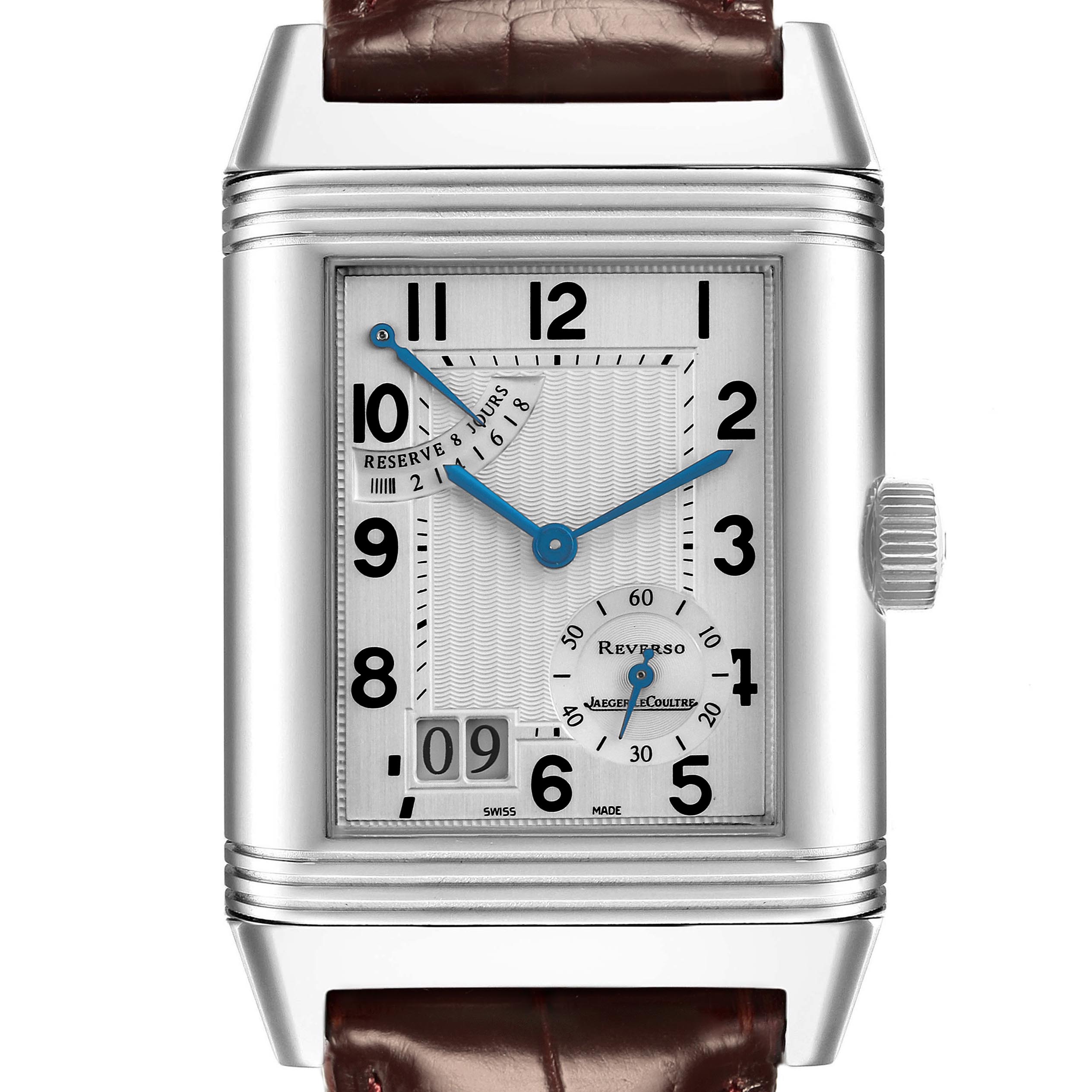 The Jaeger-LeCoultre Reverso watch is shown from a front angle, highlighting its rectangular dial, crown, and leather strap.