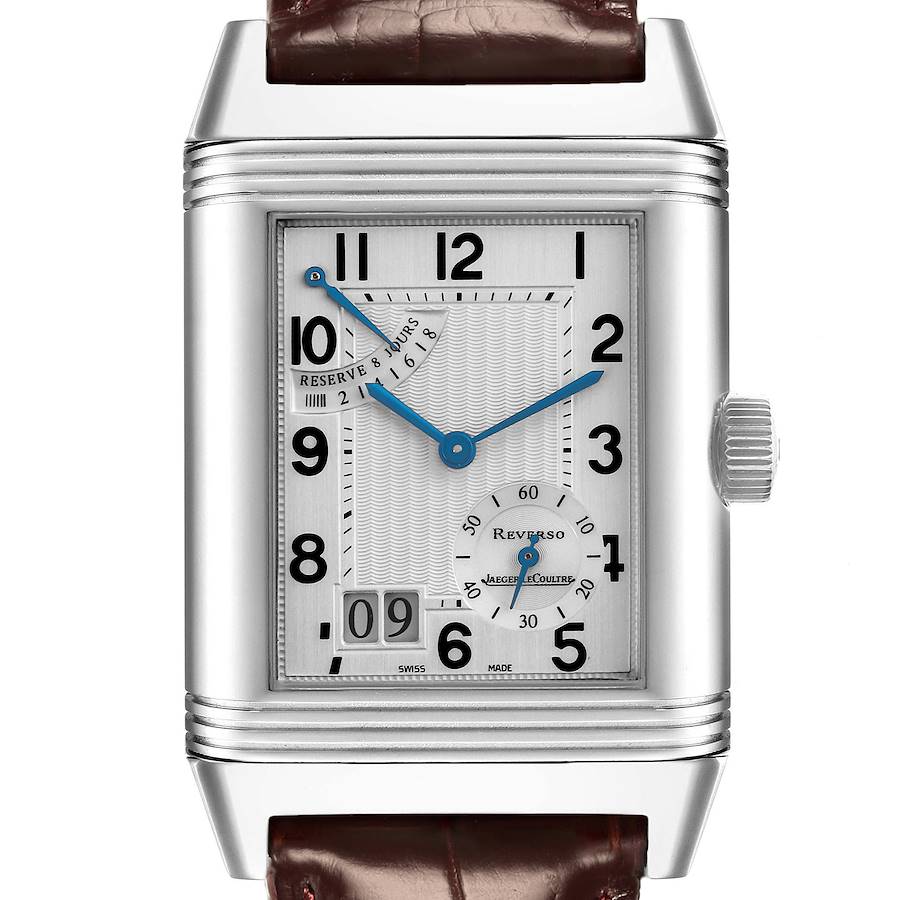 The Jaeger-LeCoultre Reverso watch is shown from a front angle, highlighting its rectangular dial, crown, and leather strap.