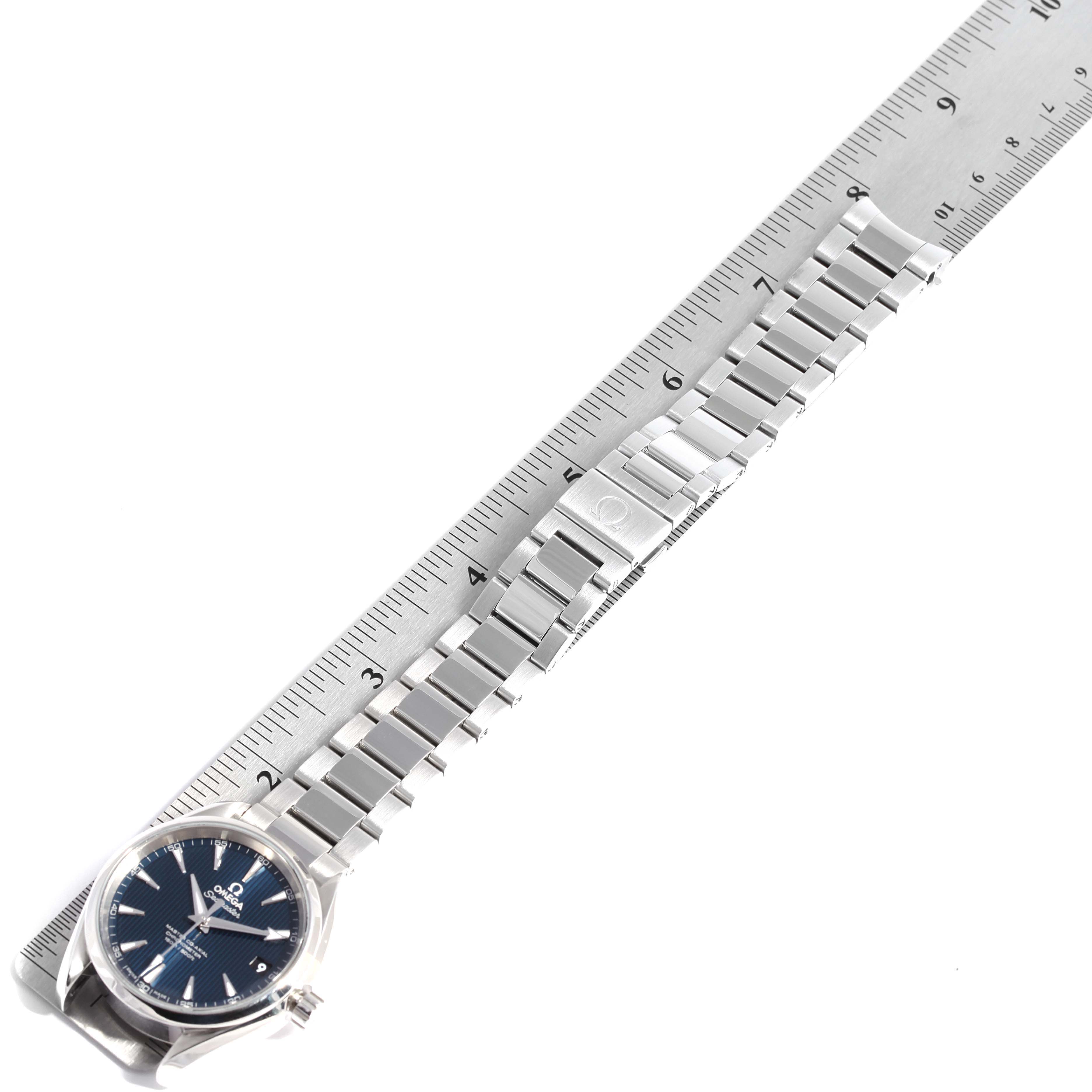 The image shows an Omega Aqua Terra 231.10.39.21.03.002 Men
s Stainless Steel Blue Dial 231.10.39.21.03.002 Men
s Stainless Steel Blue Dial watch laid flat with its metal bracelet alongside a ruler for measurement.