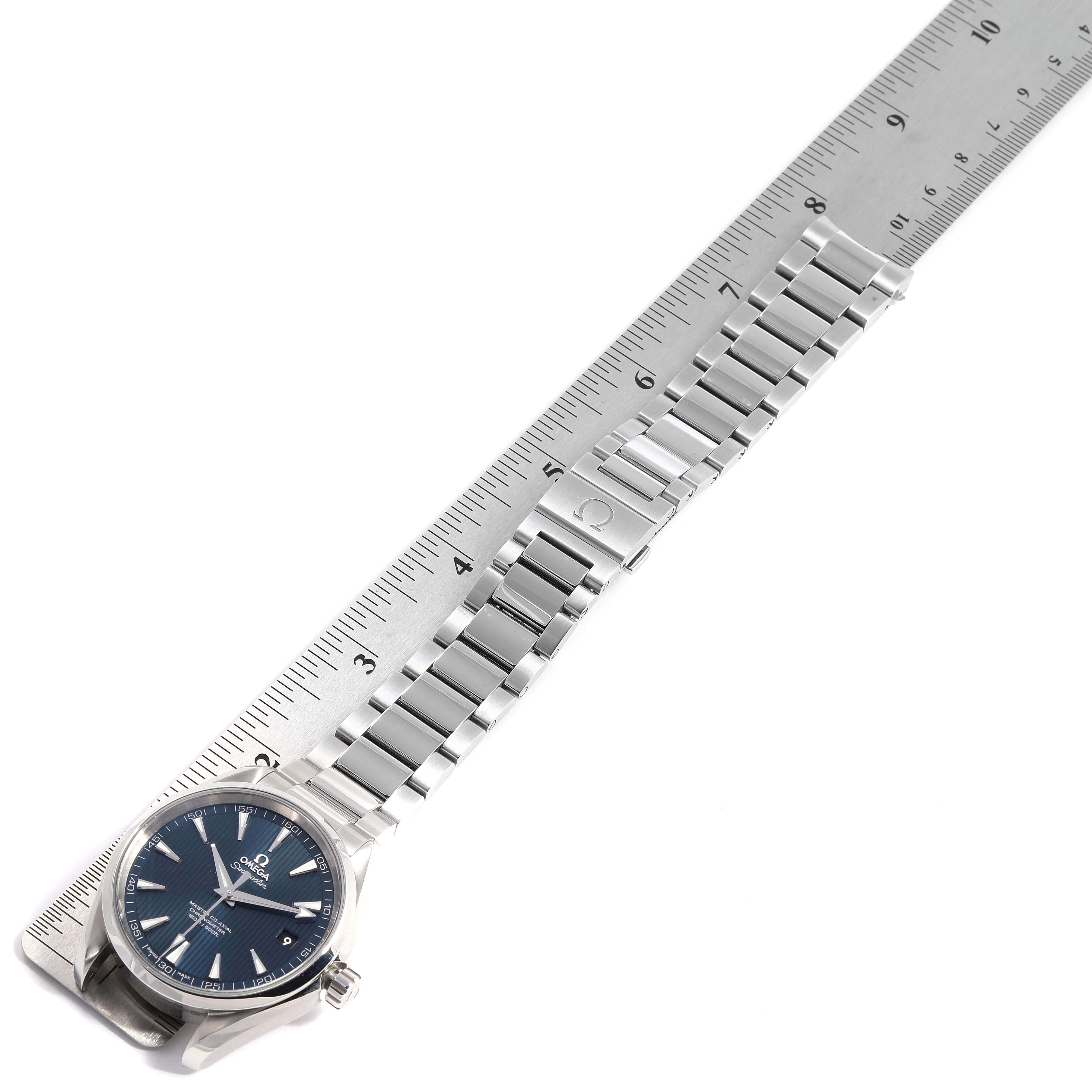 The image shows the Omega Aqua Terra 231.10.42.21.03.003 Men
s Stainless Steel Blue Dial 231.10.42.21.03.003 Men
s Stainless Steel Blue Dial watch face and metal bracelet at a top-down angle, laid out next to a ruler.