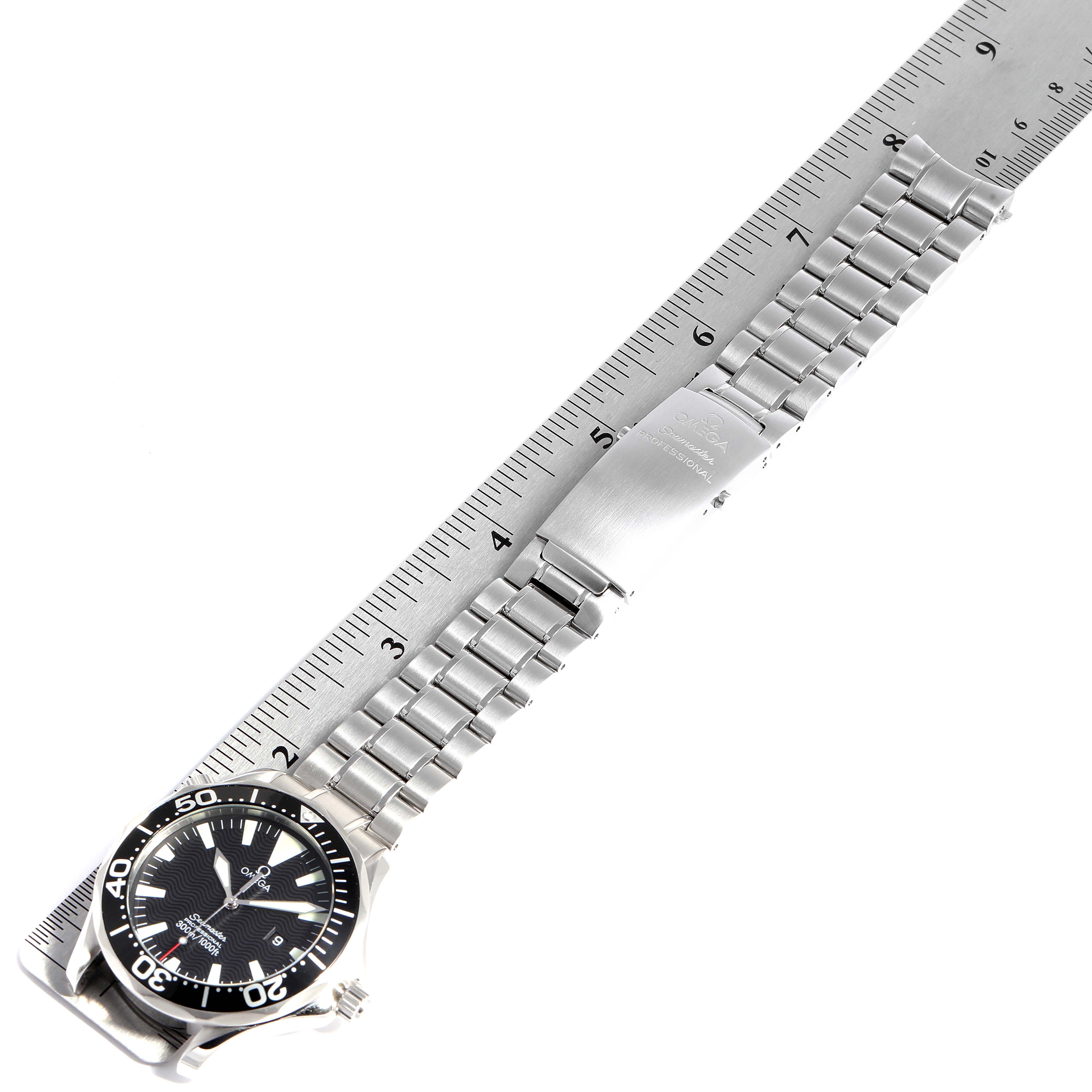 The Omega Seamaster 2264.50.00 Men
s Stainless Steel Black Dial 2264.50.00 Men
s Stainless Steel Black Dial watch is shown from an overhead angle, including the face, bezel, and metal bracelet with a clasp.