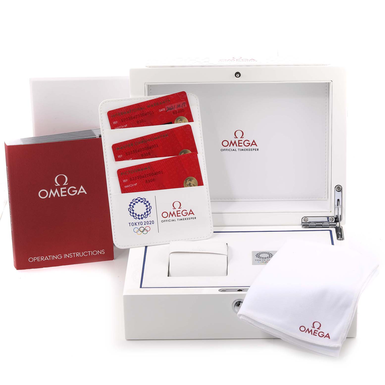 The image shows accessories for the Omega Seamaster 522.30.42.20.04.001 Men's Stainless Steel White Dial 522.30.42.20.04.001 Men's Stainless Steel White Dial, including an operating manual, warranty cards, a box, and a cleaning cloth.