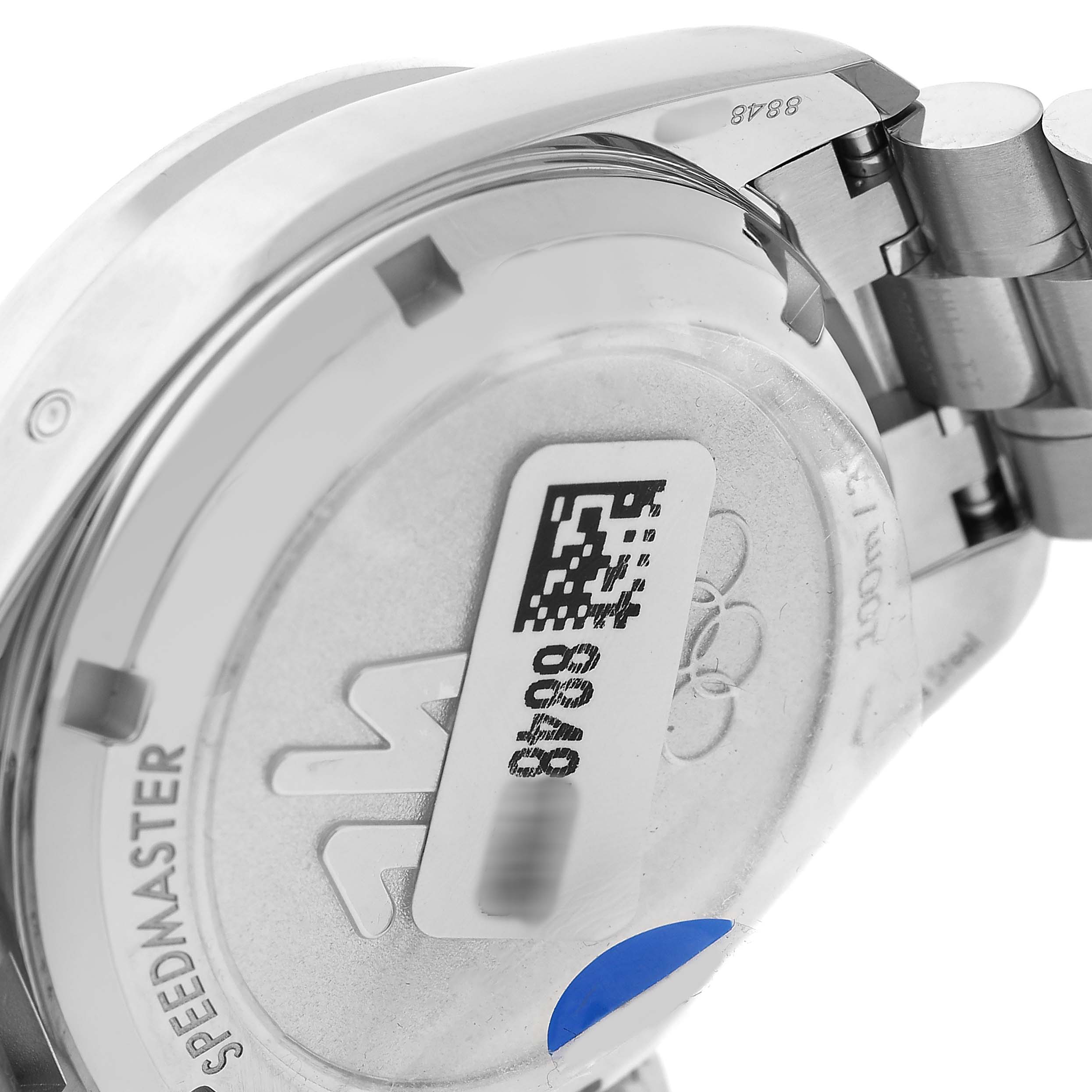 The image shows the case back and part of the bracelet of an Omega Speedmaster 522.30.38.50.04.001 Men's Stainless Steel White Dial watch from a side angle.