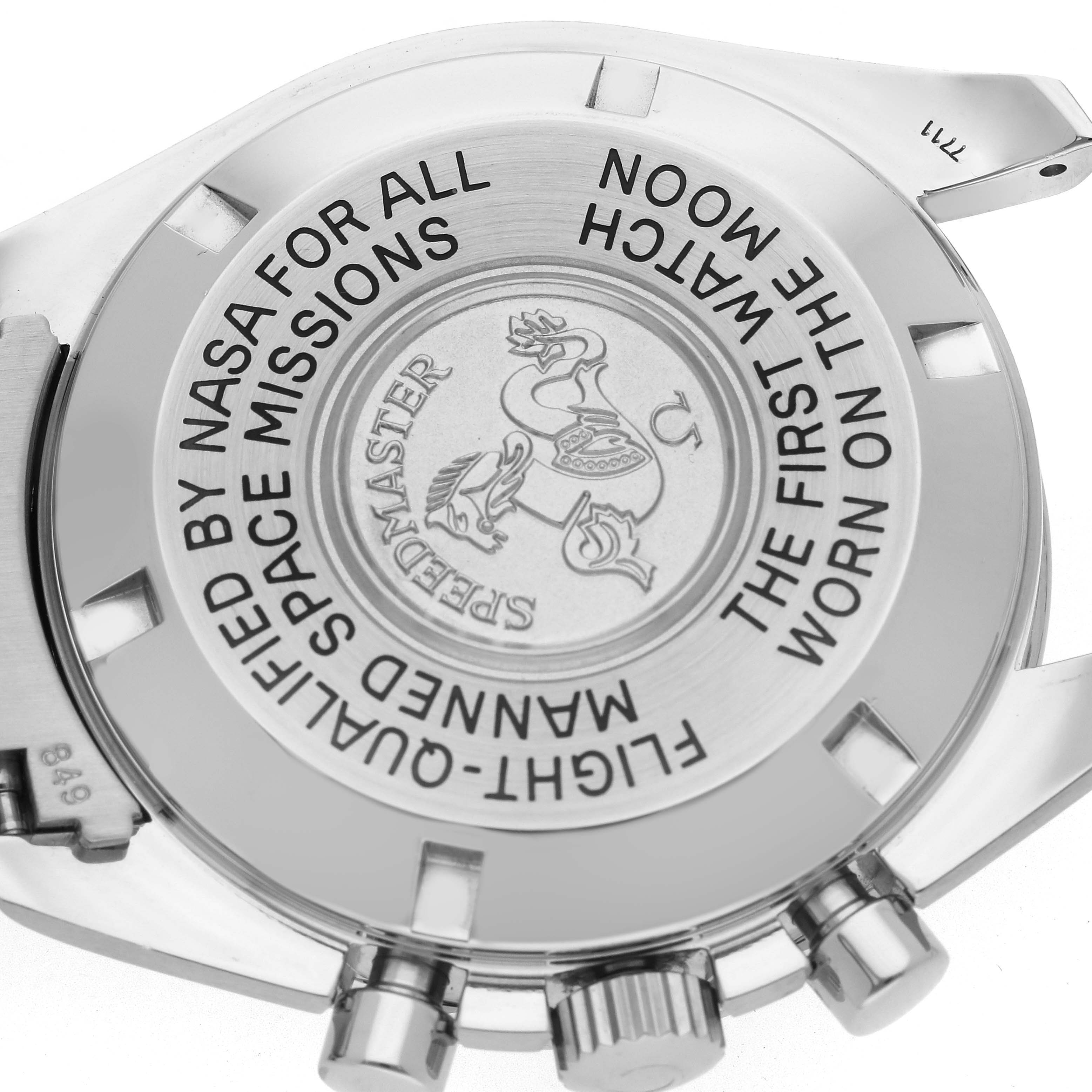 The image shows the case back of an Omega Speedmaster 3570.40.00 Men
s Stainless Steel Grey Dial 3570.40.00 Men
s Stainless Steel Grey Dial, featuring engraved text and logos.