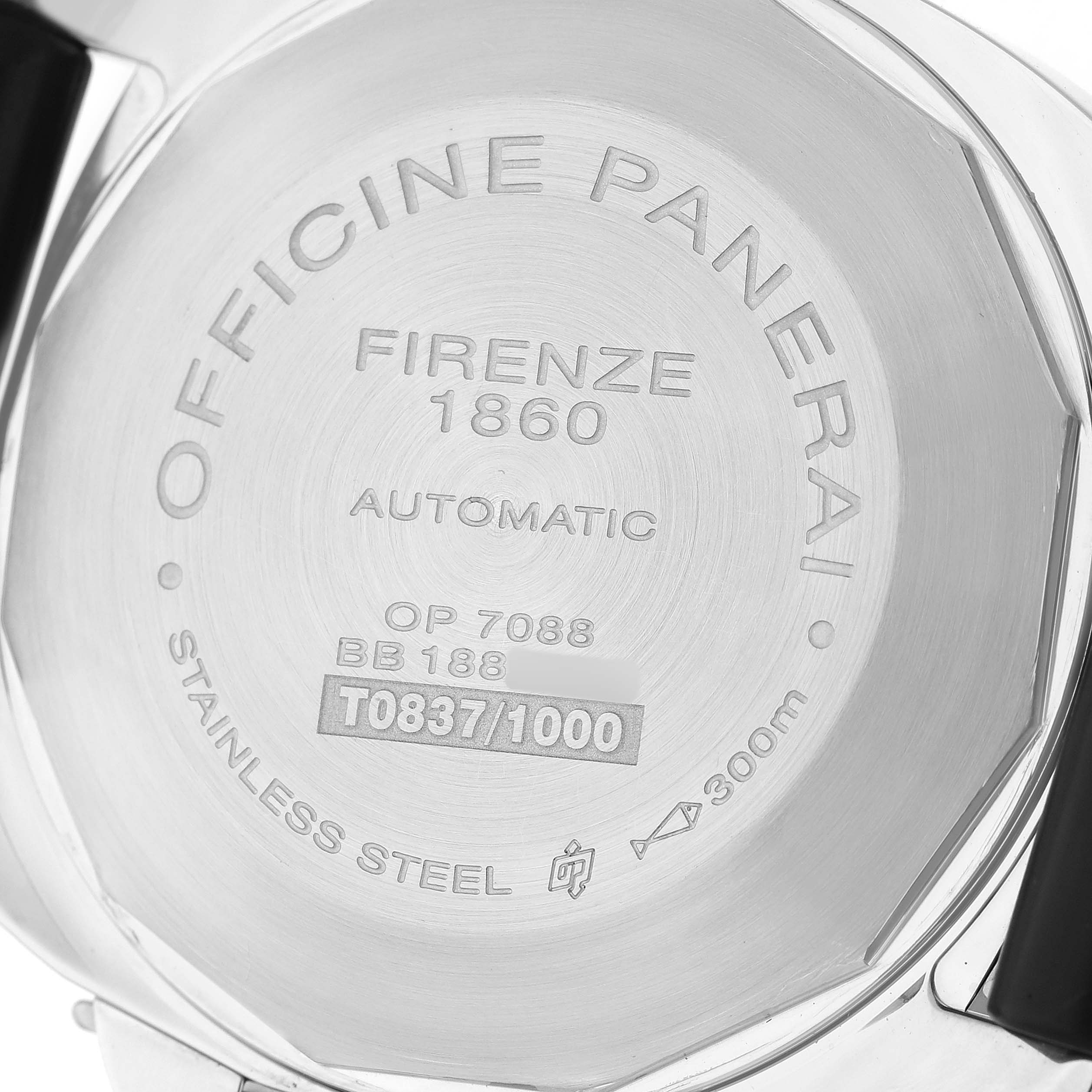 The image shows the back of a Panerai Luminor PAM00088 Men's Stainless Steel Black Dial watch, detailing model information and material specifications.