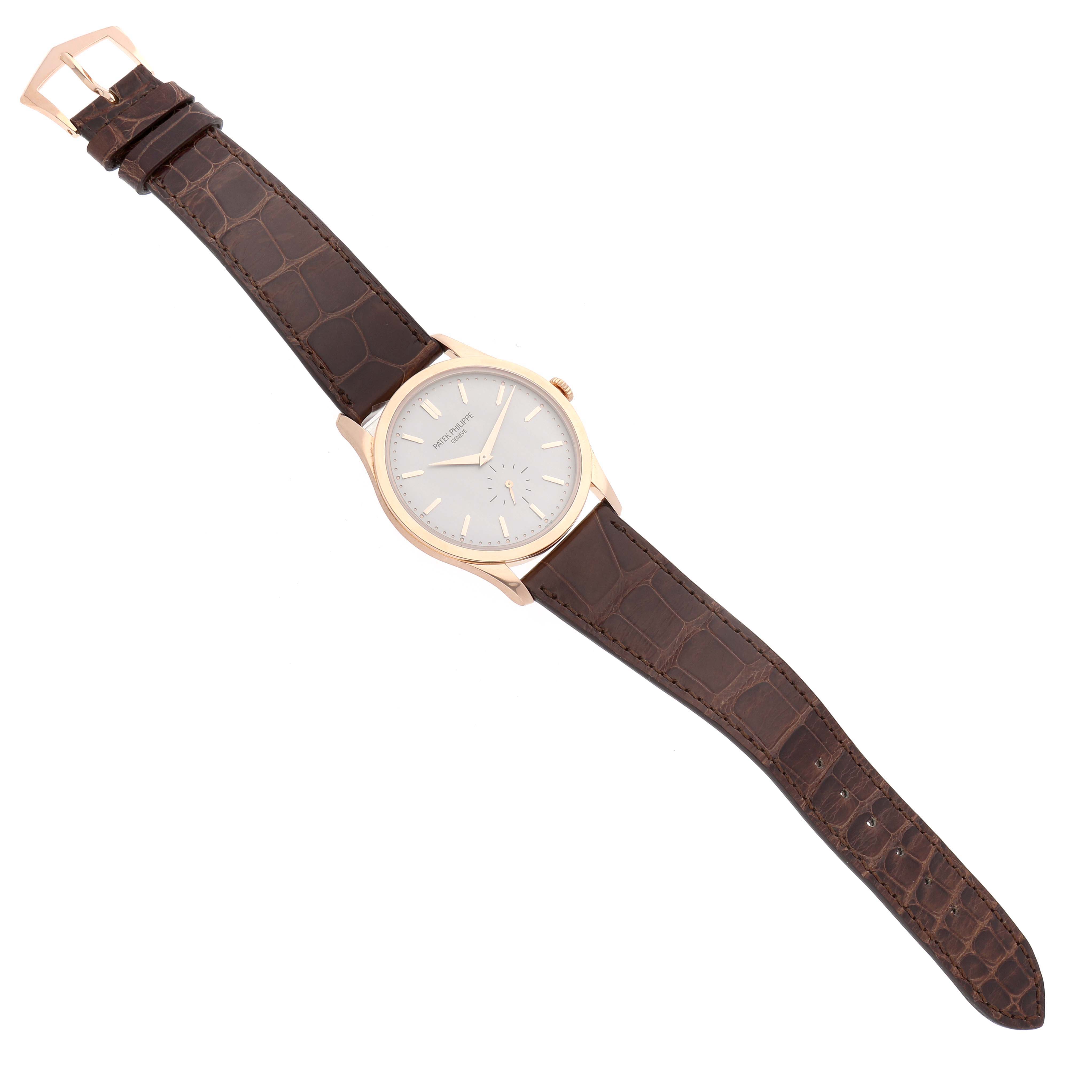 The Patek Philippe Calatrava 5196R-001 Men's Rose Gold Silver Dial watch is shown from above, displaying its face, case, and full leather strap.