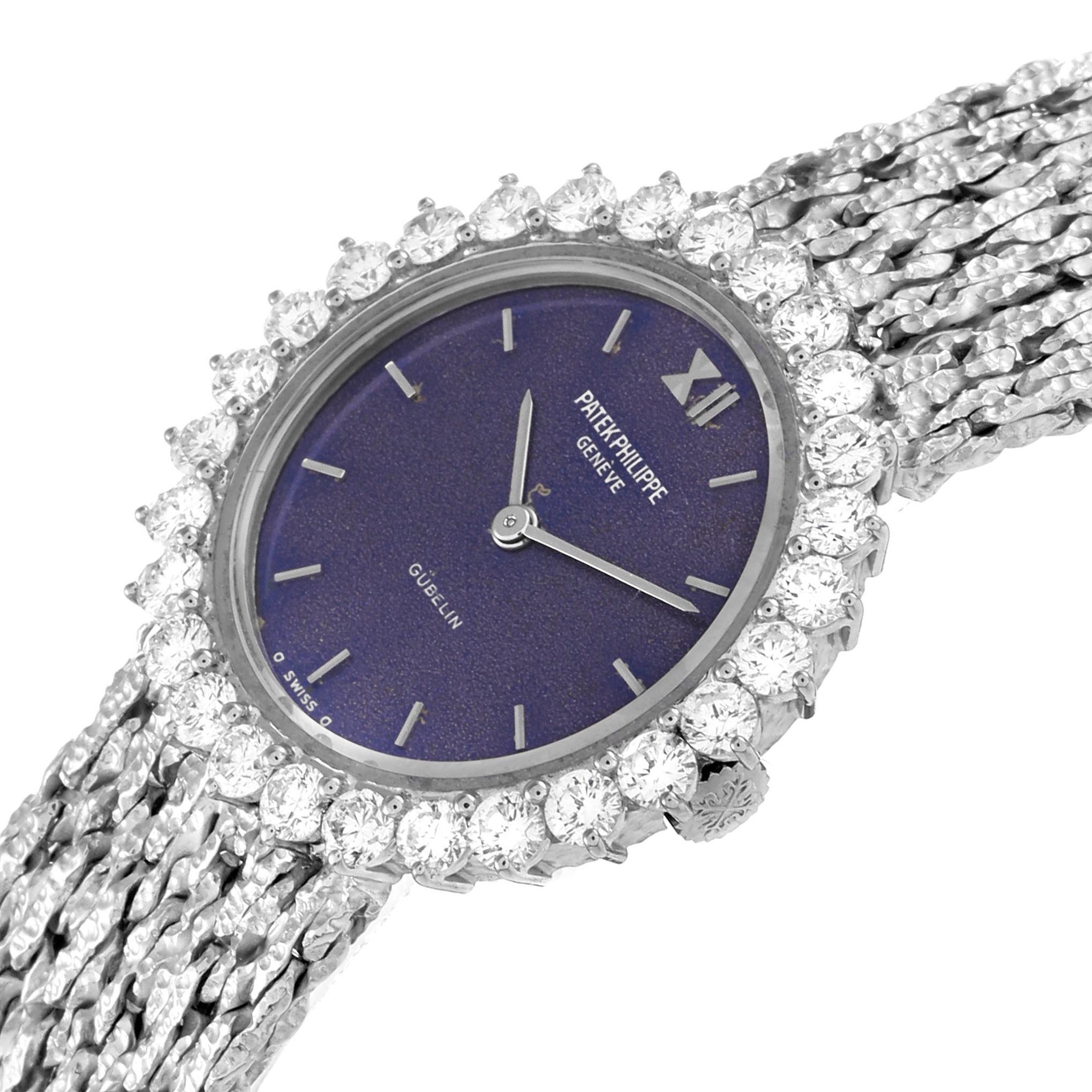 The Patek Philippe Calatrava 4136/001 Women
s White Gold Blue Dial 4136/001 Women
s White Gold Blue Dial watch is shown at an angled view, highlighting the bezel, dial, and textured band.