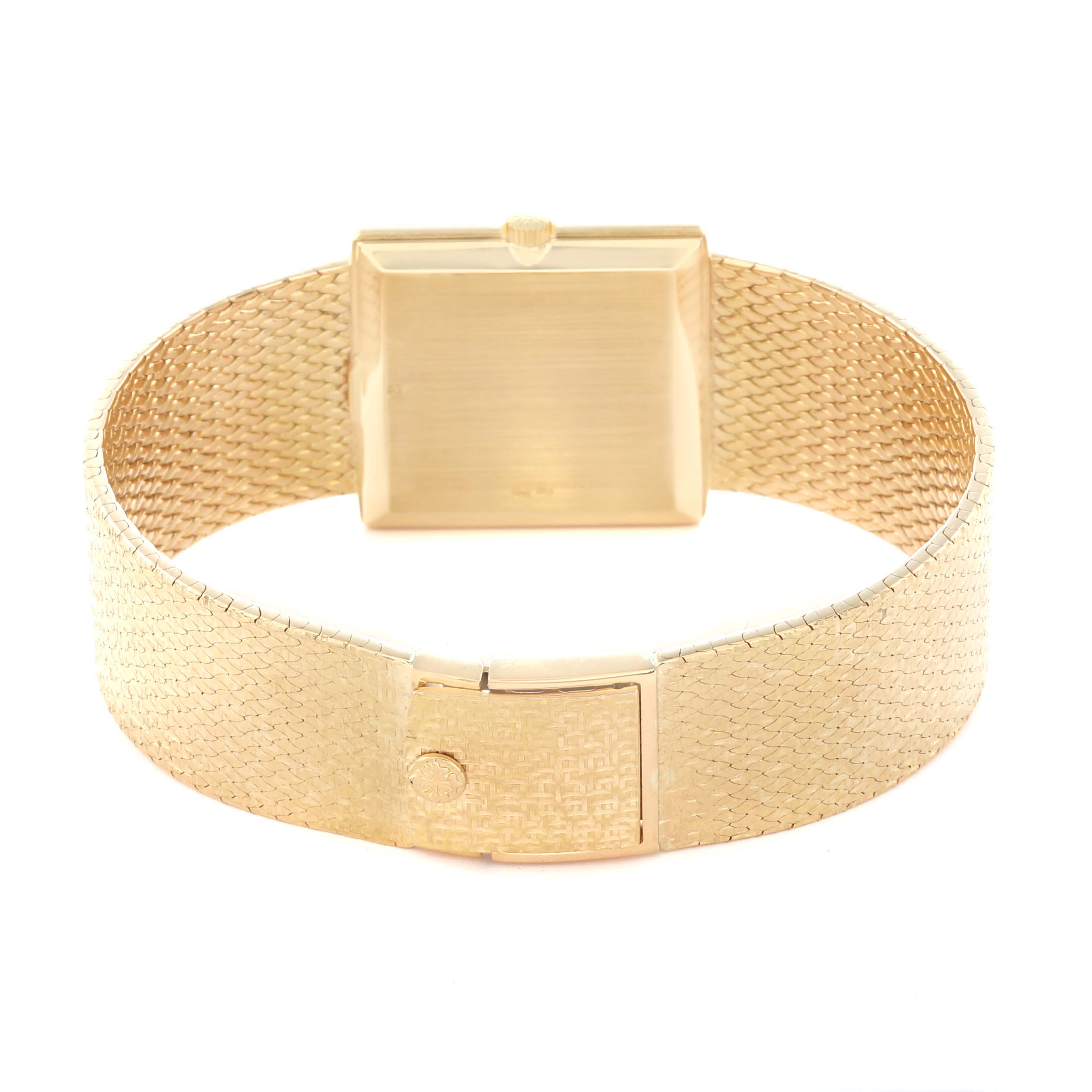 The image shows the back of a Vintage Patek Philippe watch, highlighting its gold mesh band and clasp.