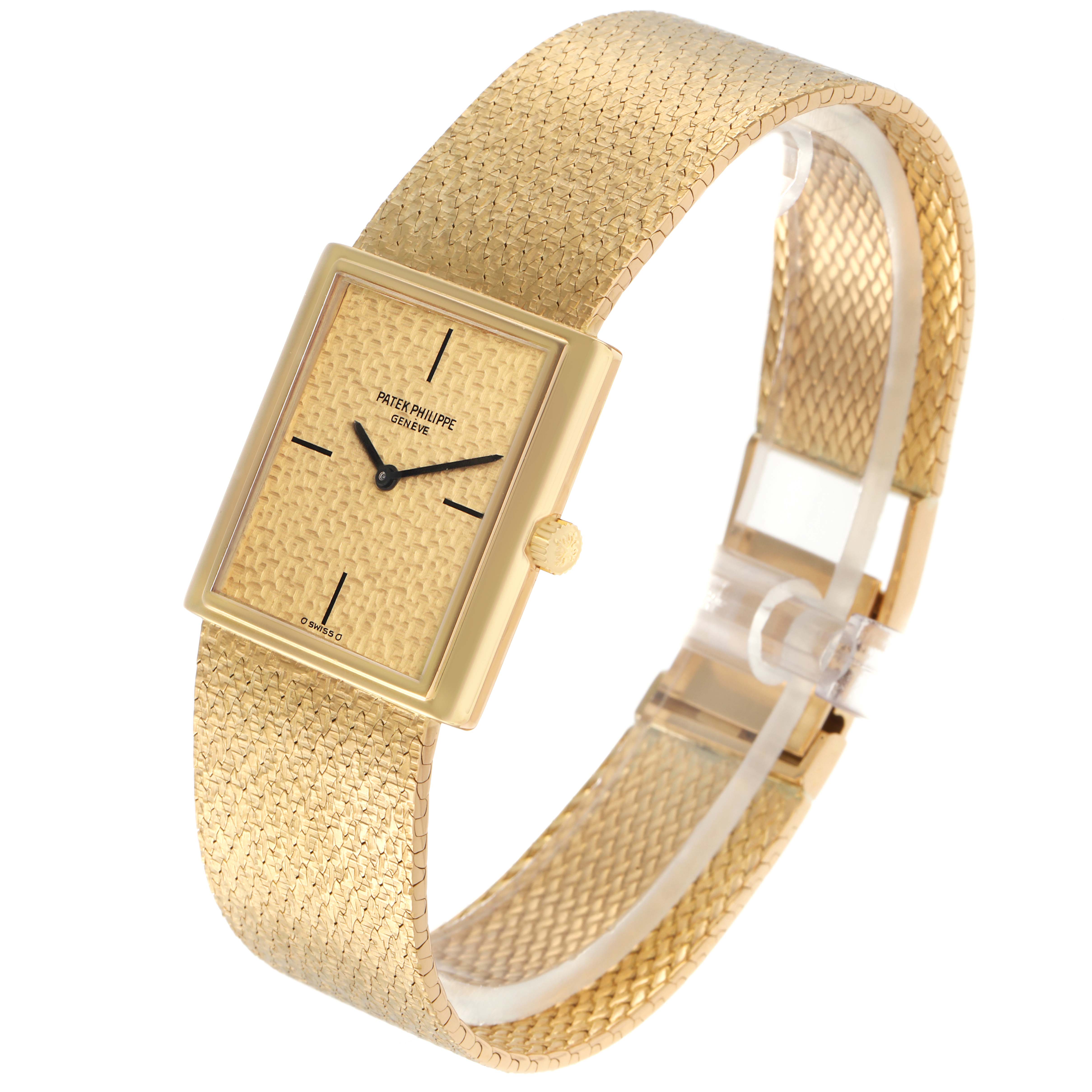The Patek Philippe Vintage 3671 Women
s Yellow Gold Champagne Dial 3671 Women
s Yellow Gold Champagne Dial watch is shown from an angled top view, highlighting the textured dial, gold case, and matching woven bracelet.