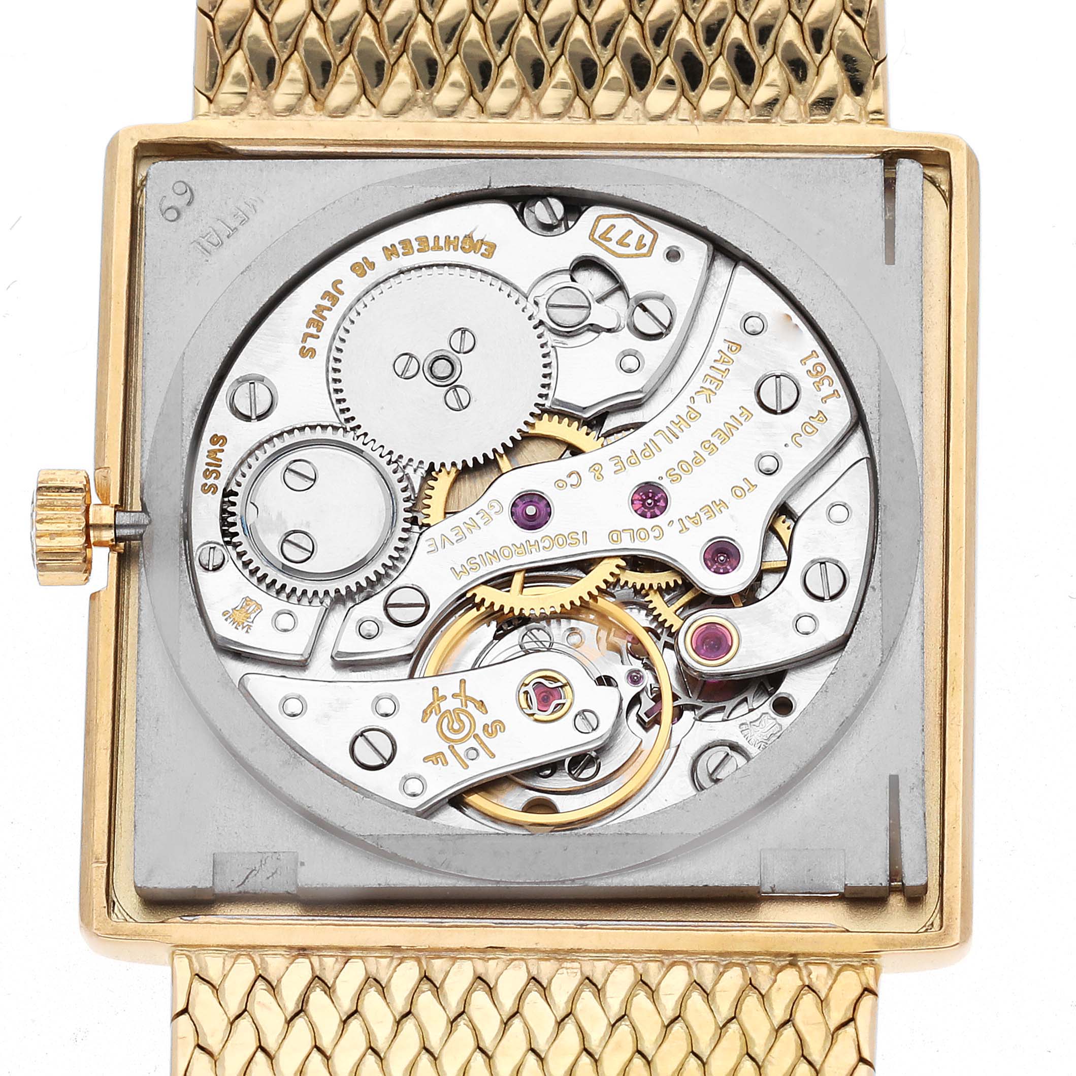 The image shows a rear view of the Patek Philippe Vintage 3671 Women
s Yellow Gold Champagne Dial 3671 Women
s Yellow Gold Champagne Dial model, highlighting its intricate movement and gears.