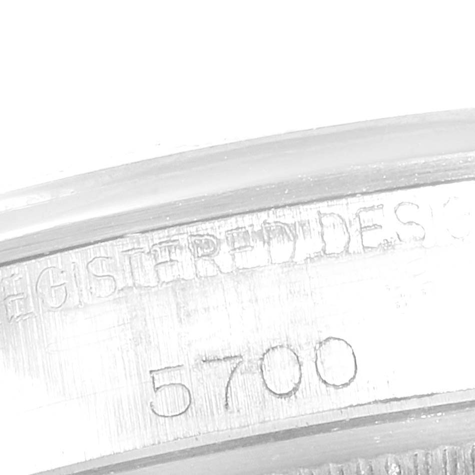The image shows a close-up of the case side of a Rolex Air-King 5700 Men's Stainless Steel Silver Dial 5700 Men's Stainless Steel Silver Dial watch, highlighting the model number "5700" and the text "REGISTERED DESIGN."