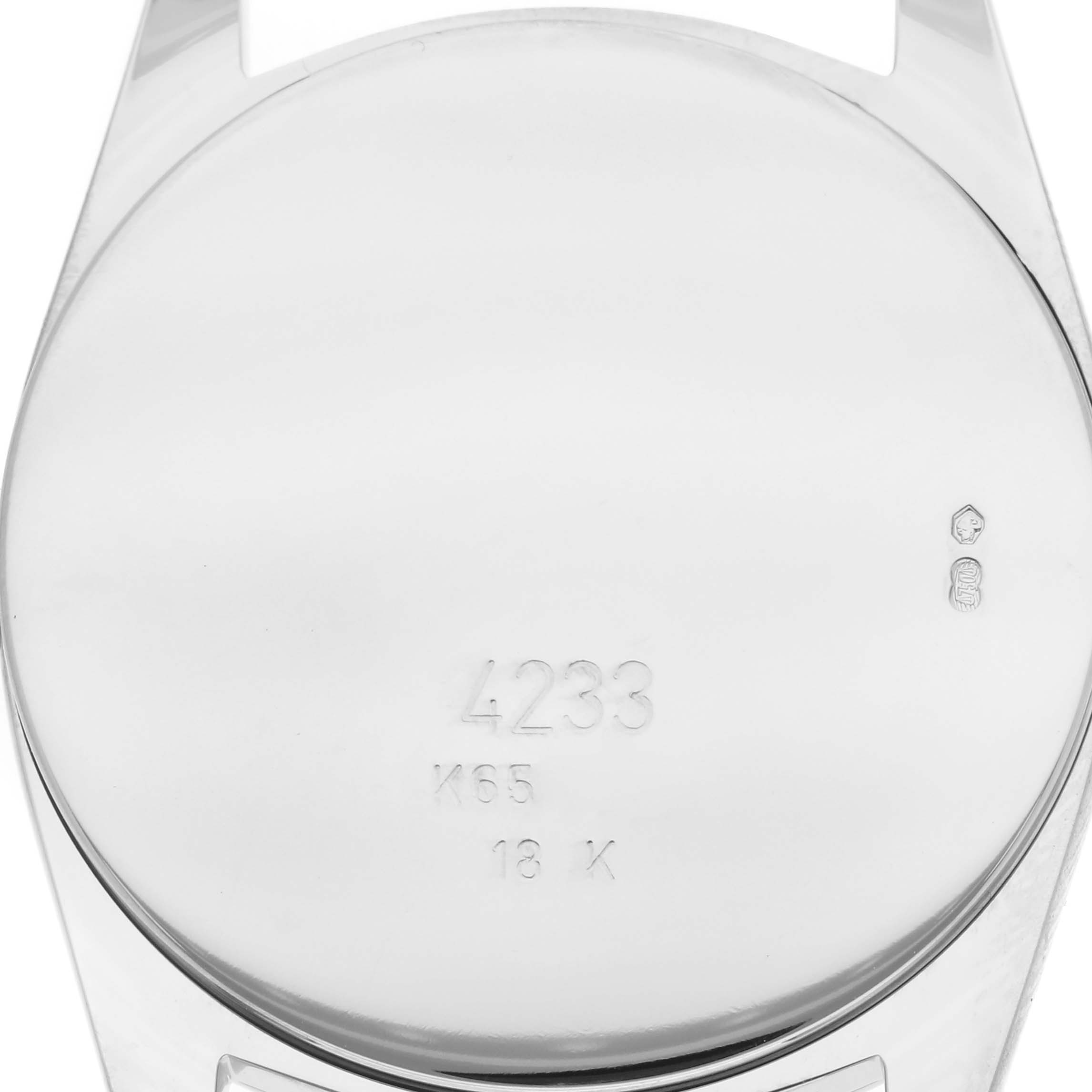 The image shows the case back of a Rolex Cellini 4233/9 Men
s White Gold White Dial 4233/9 Men
s White Gold White Dial watch, highlighting engravings and hallmarks.