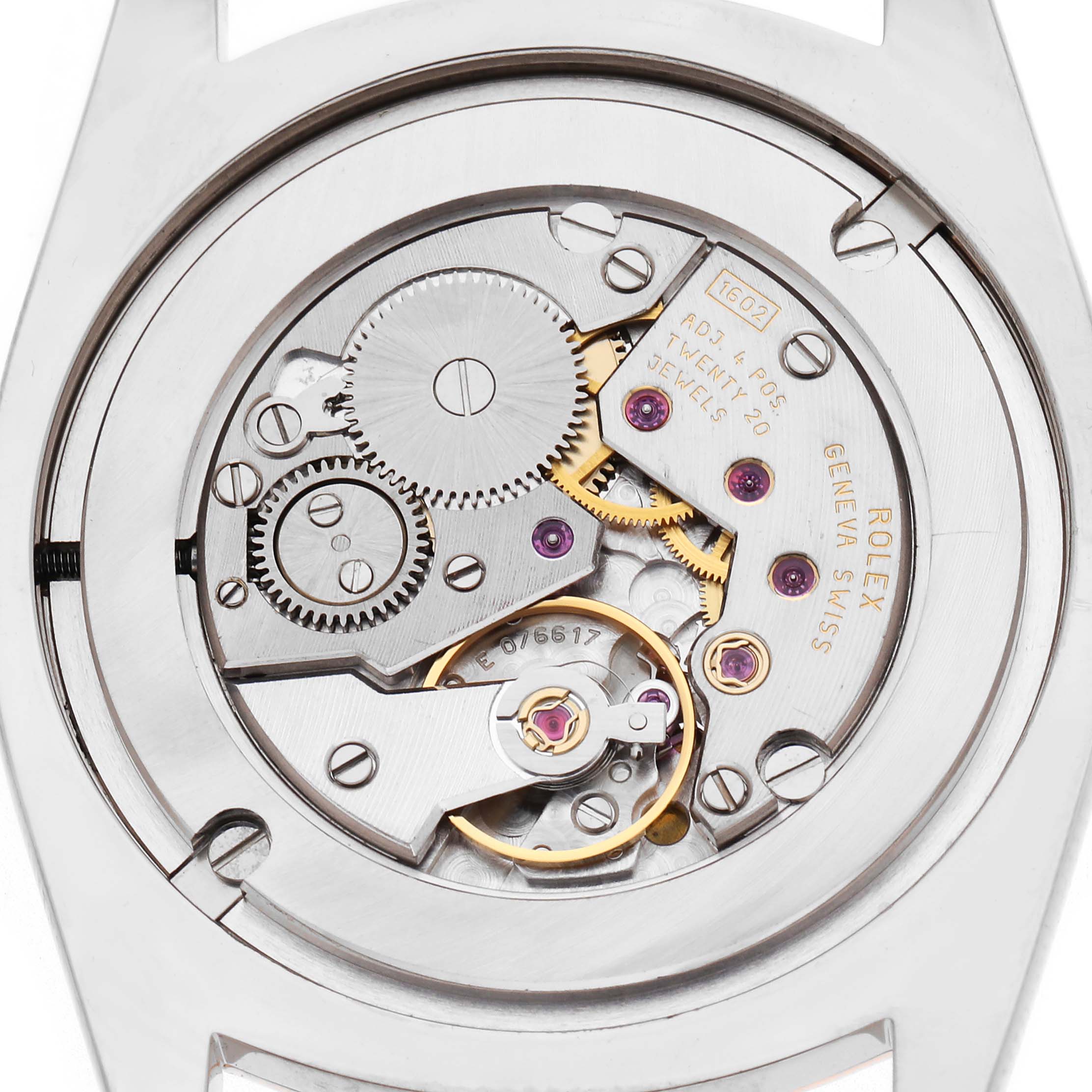 The image shows the movement of a Rolex Cellini 4233/9BIC Men
s White Gold White Dial 4233/9BIC Men
s White Gold White Dial watch from a top-down angle, highlighting gears and jewels.