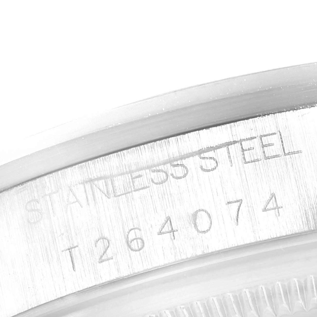 This image shows a close-up of the stainless steel back case with engraved serial number of a Rolex Date 15200 Men's Stainless Steel Silver Dial 15200 Men's Stainless Steel Silver Dial model watch.
