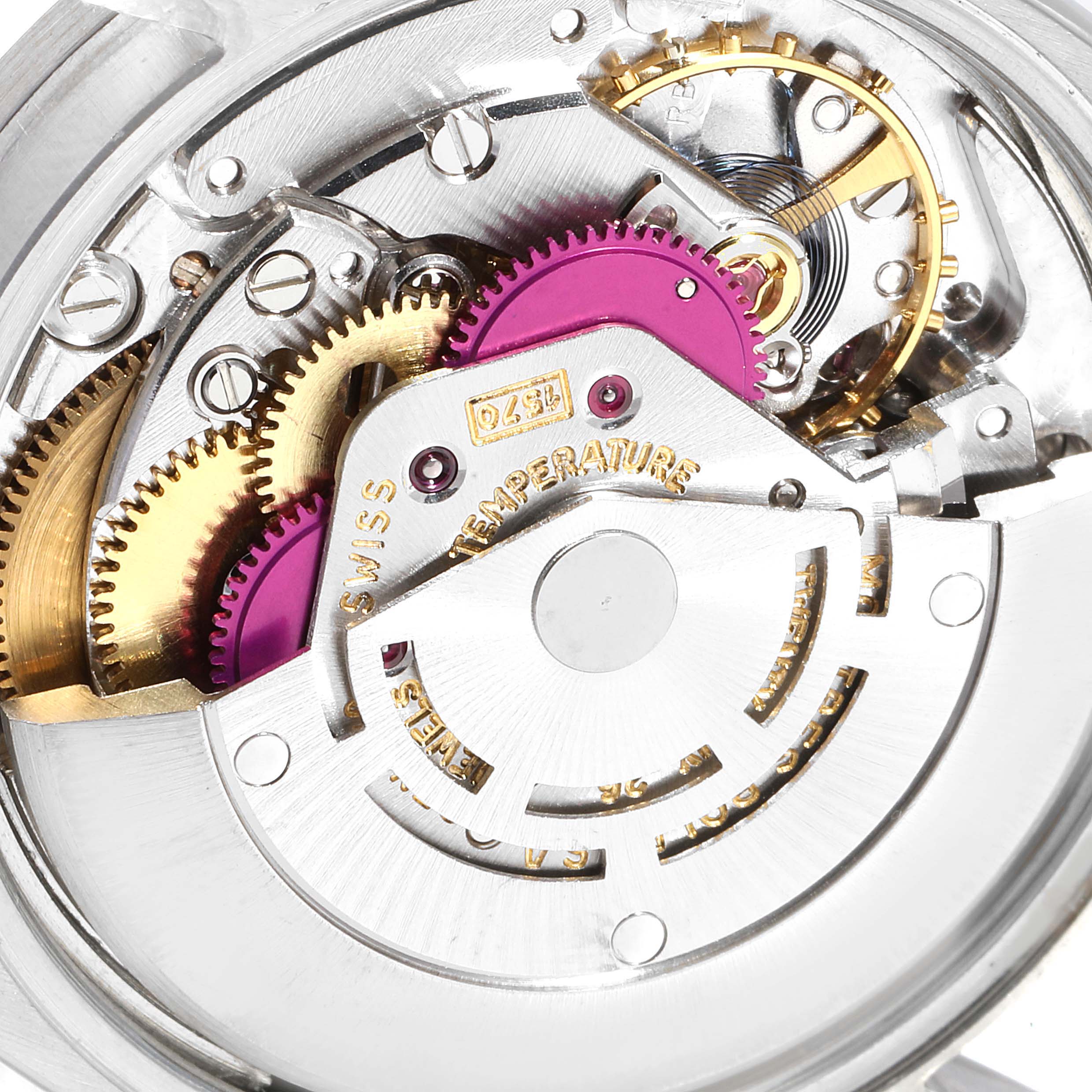 This image shows a close-up view of the internal mechanism of a Vintage Collection model by Rolex, highlighting gears and intricate components.