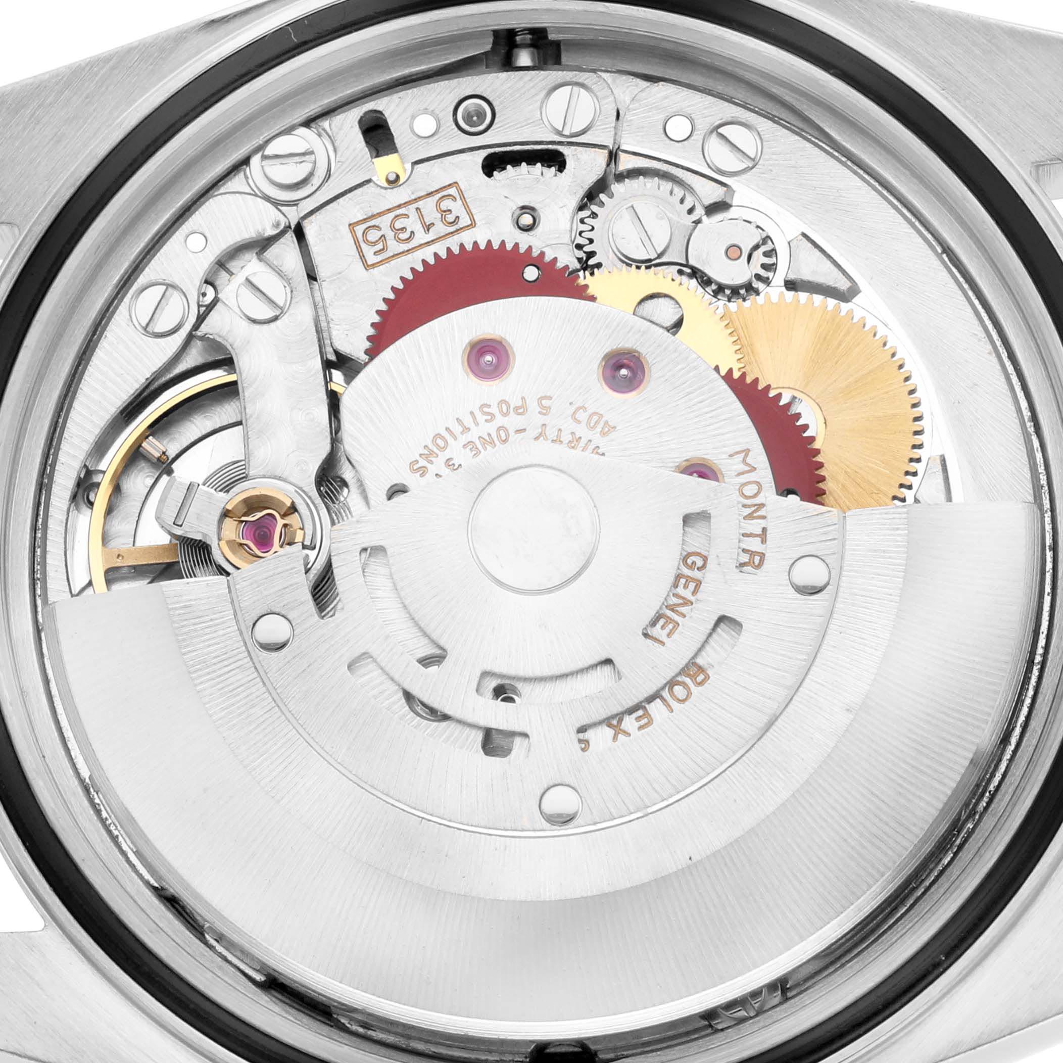 The image shows the internal mechanism of a Rolex Datejust 16233 Men
s Steel and Gold (two tone) White Dial 16233 Men
s Steel and Gold (two tone) White Dial watch from a top-down angle, revealing gears and components.