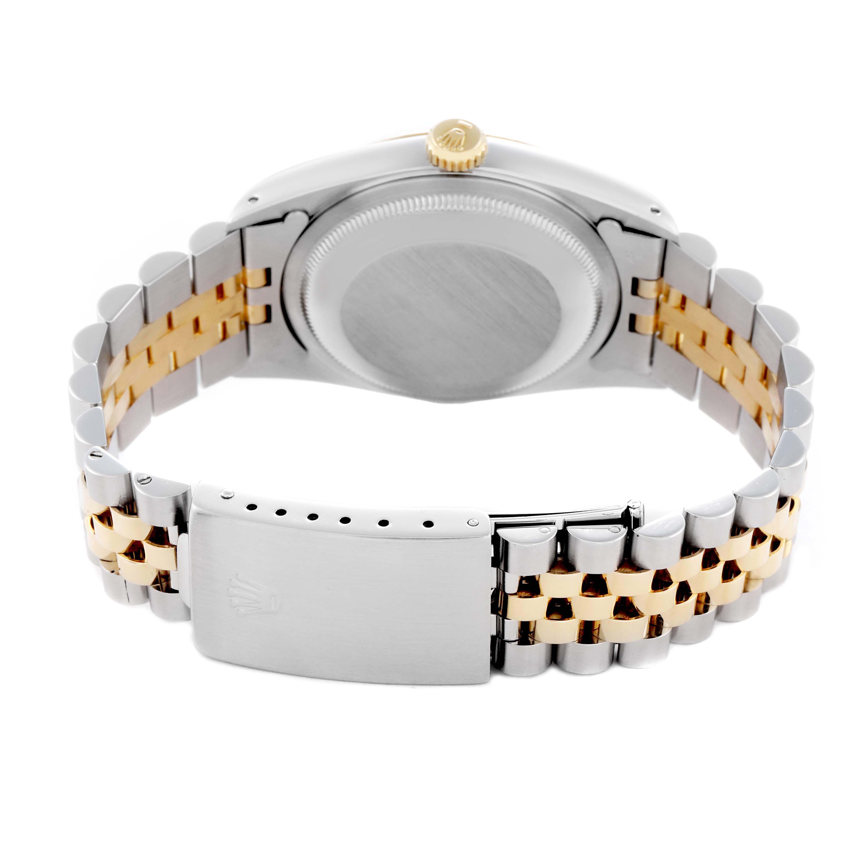 The Rolex Datejust 16233 Men
s Steel and Gold (two tone) White Dial 16233 Men
s Steel and Gold (two tone) White Dial watch is shown from the back, displaying the case, crown, and two-tone Jubilee bracelet.