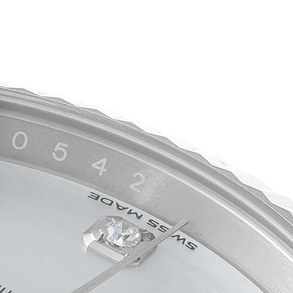 This image shows a close-up of the bezel and dial of a Rolex Datejust 41 126334 Men's Stainless Steel Mother of Pearl Dial 126334 Men's Stainless Steel Mother of Pearl Dial, specifically focusing on the "Swiss Made" text and a diamond hour marker.
