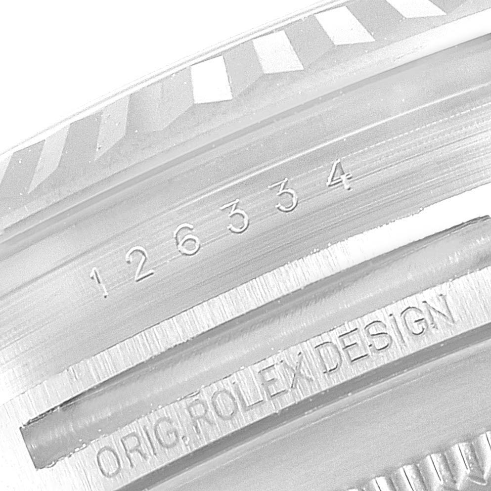 This is a close-up view of the case back of a Rolex Datejust 41 126334 Men's Stainless Steel Mother of Pearl Dial 126334 Men's Stainless Steel Mother of Pearl Dial, showing the serial number and "ORIG. ROLEX DESIGN" engraving.