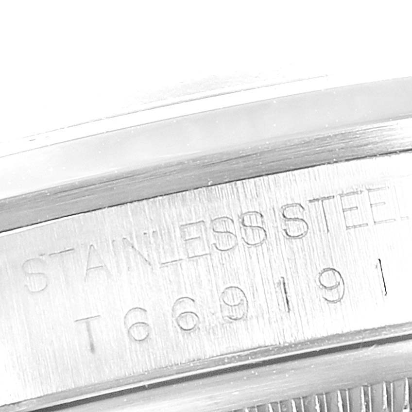 This is a close-up of the stainless steel case back of a Rolex Datejust 16200 Men
s Stainless Steel Blue Dial 16200 Men
s Stainless Steel Blue Dial watch, showing the engraved model number.
